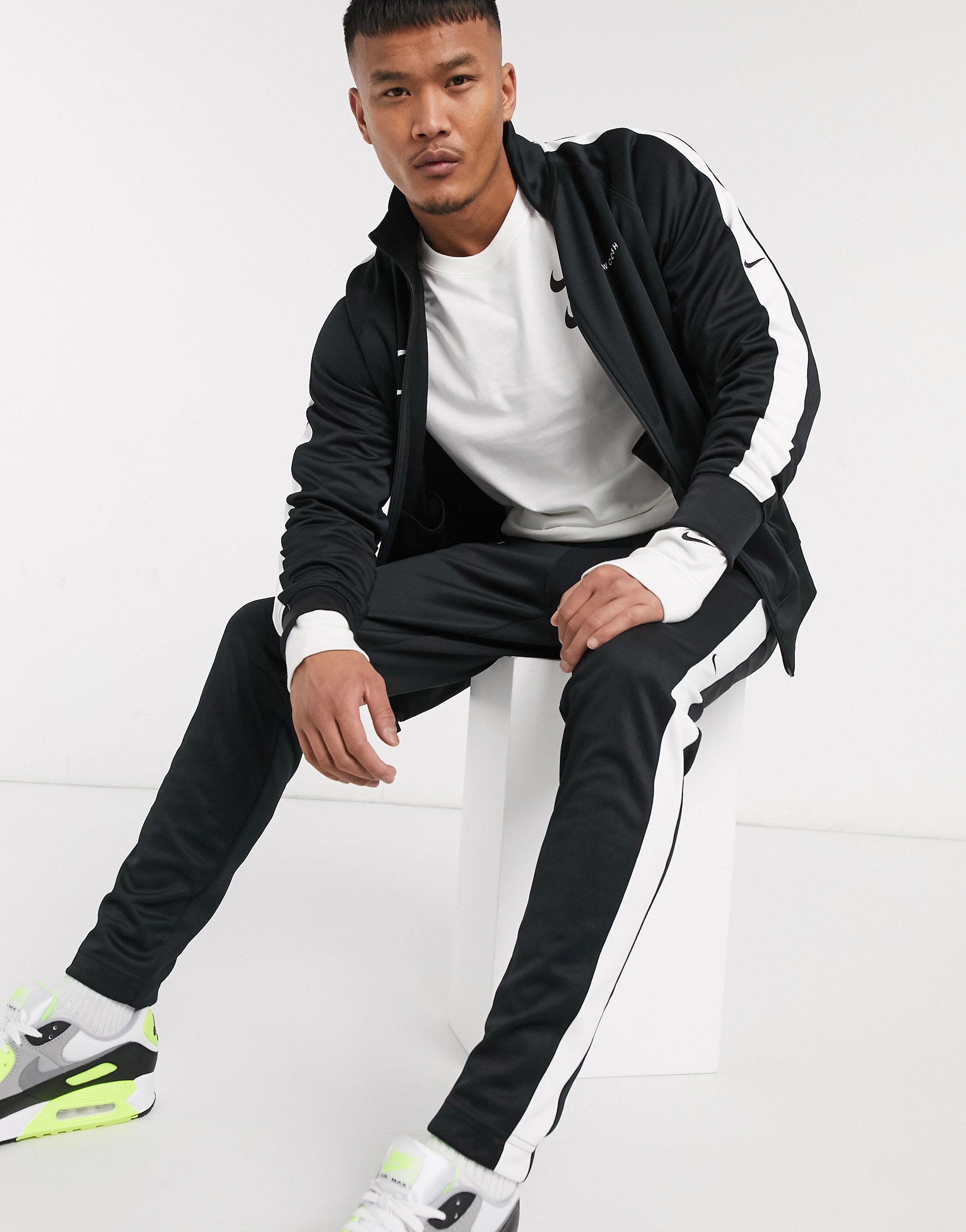 nike swoosh polyknit joggers in black