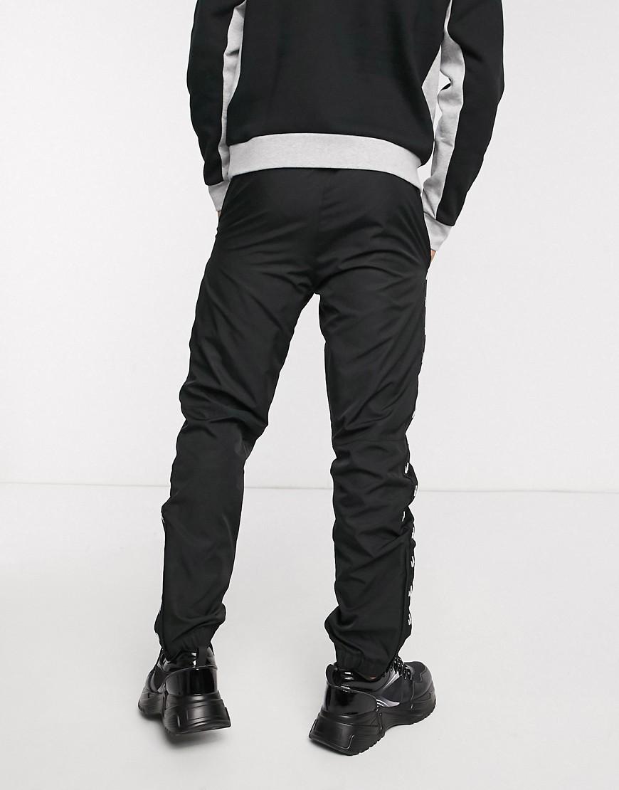 Lacoste - Pantaloni sportivi con fettuccia con logo neri da Uomo di Lacoste  Sport in Nero | Lyst