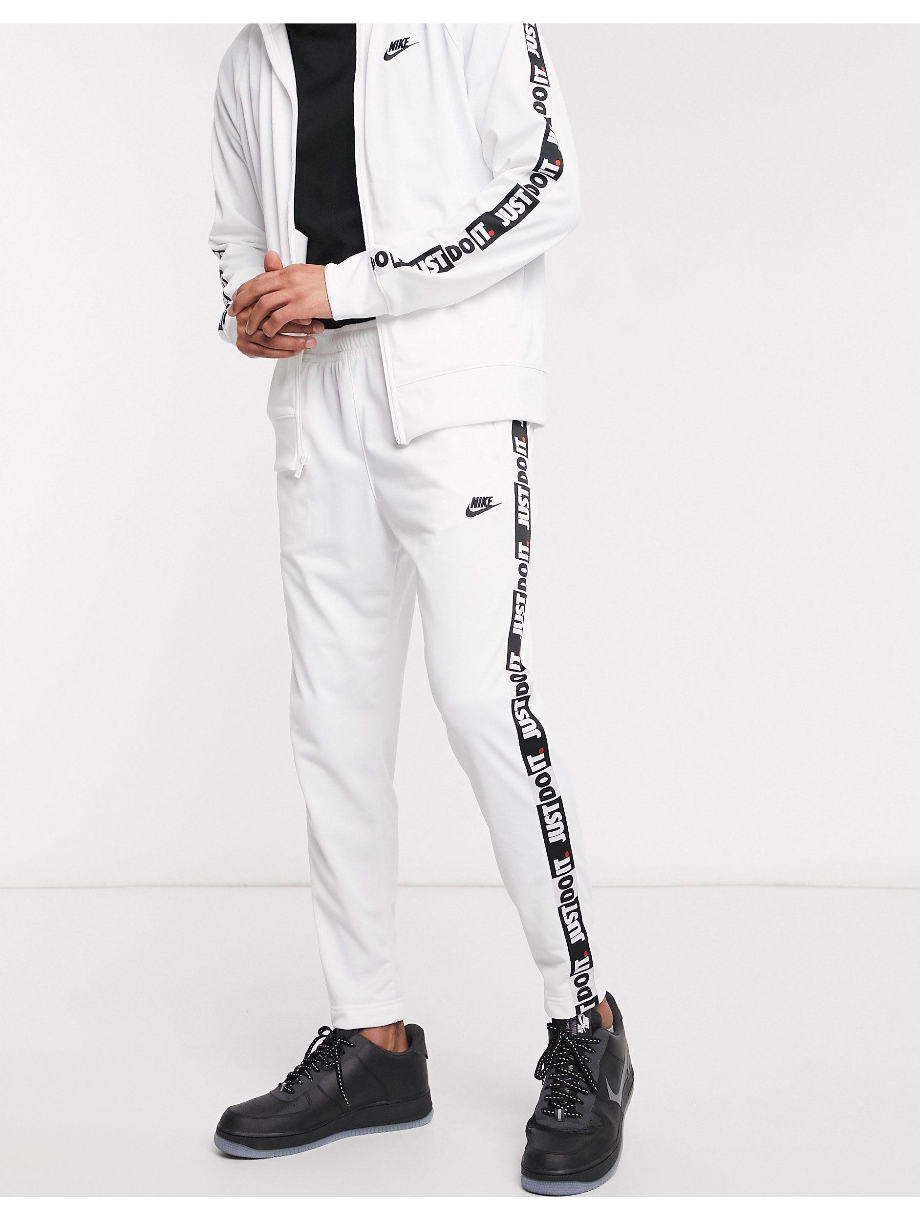 Nike Just Do It Taping Cuffed Sweatpants for Men | Lyst