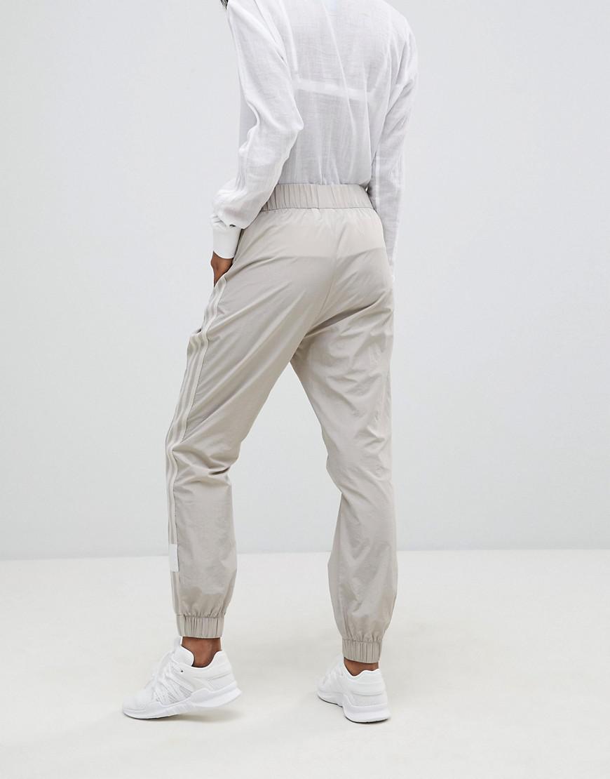 beige adidas track pants