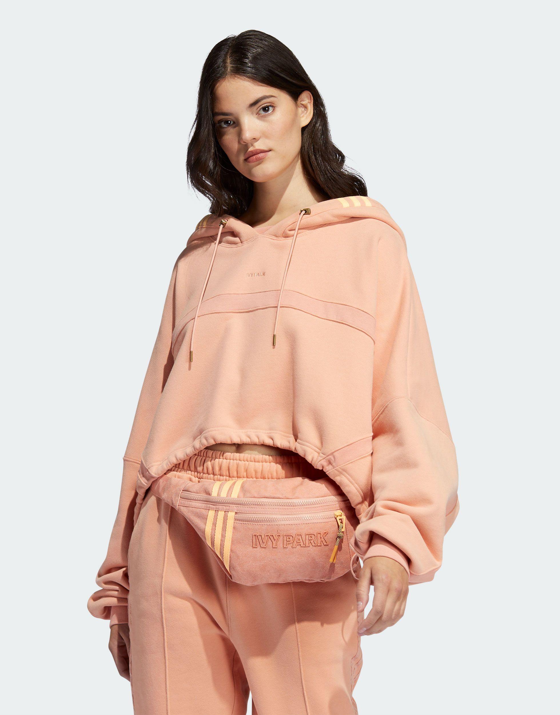 https://cdna.lystit.com/photos/asos/63e53db0/ivy-park-Pink-Adidas-Originals-X-Cropped-Hoodie.jpeg