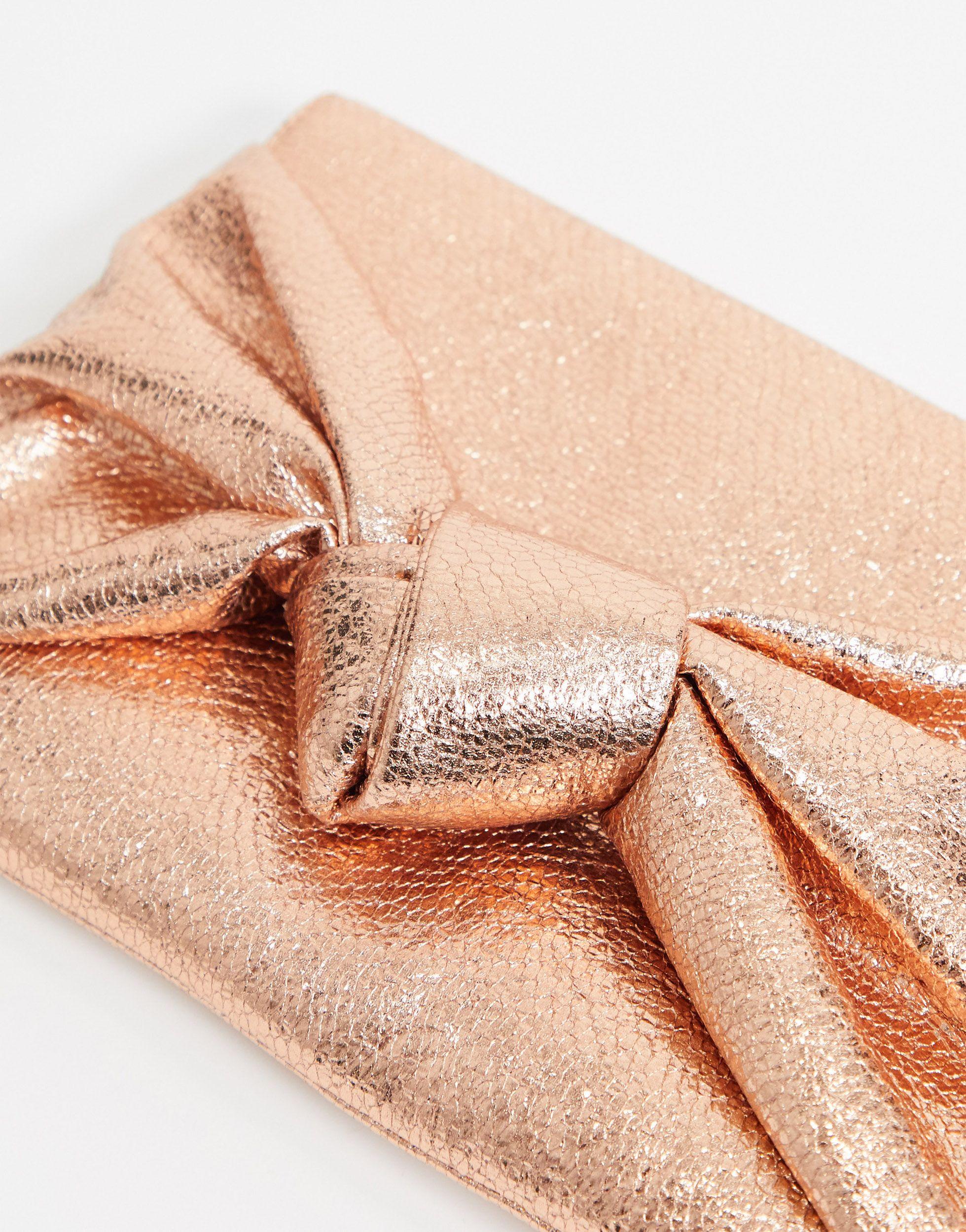 Pochette oro rosa con fiocco oversize di ASOS | Lyst