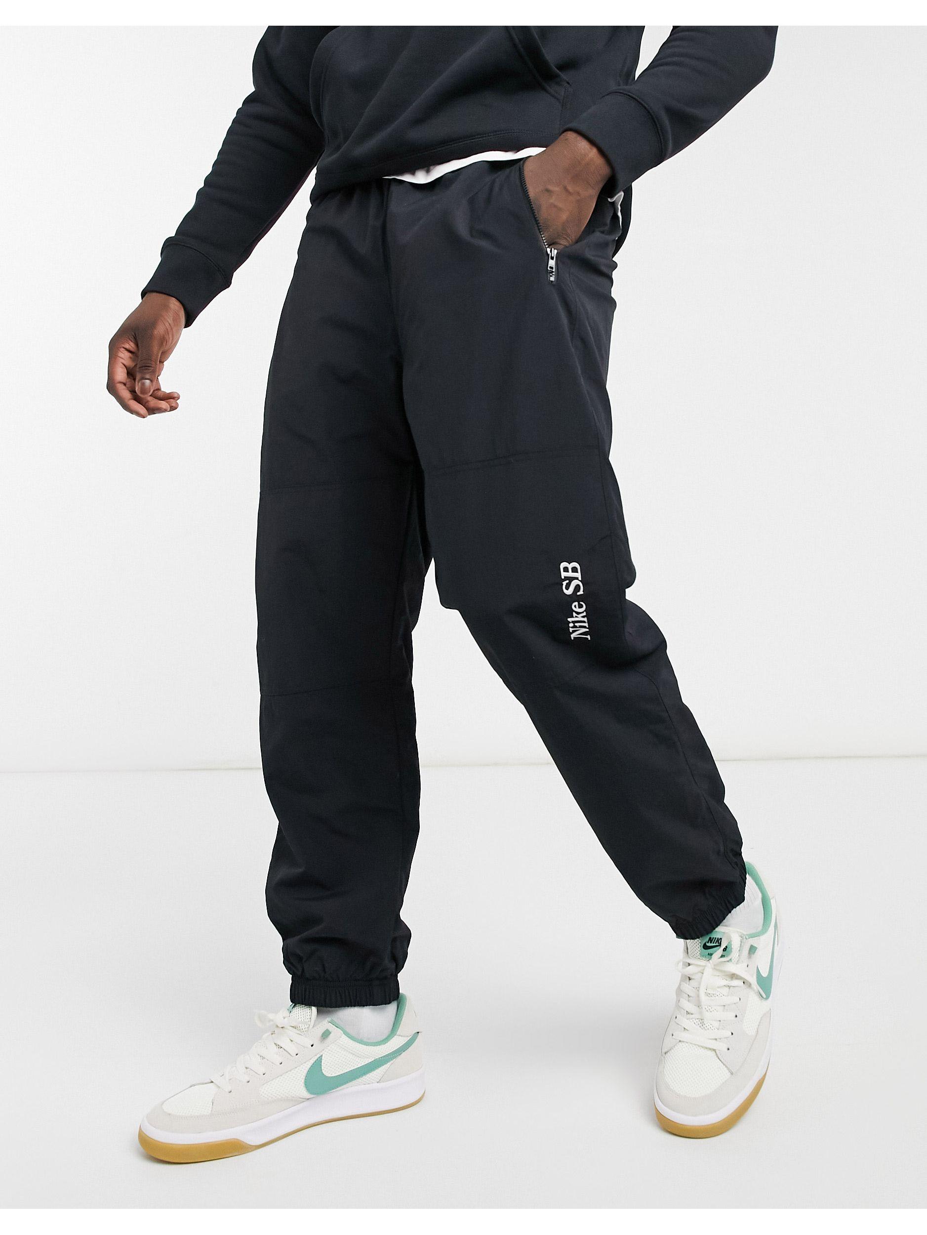 Joggers neri con fondo elasticizzato e logo da Uomo di Nike in Nero | Lyst