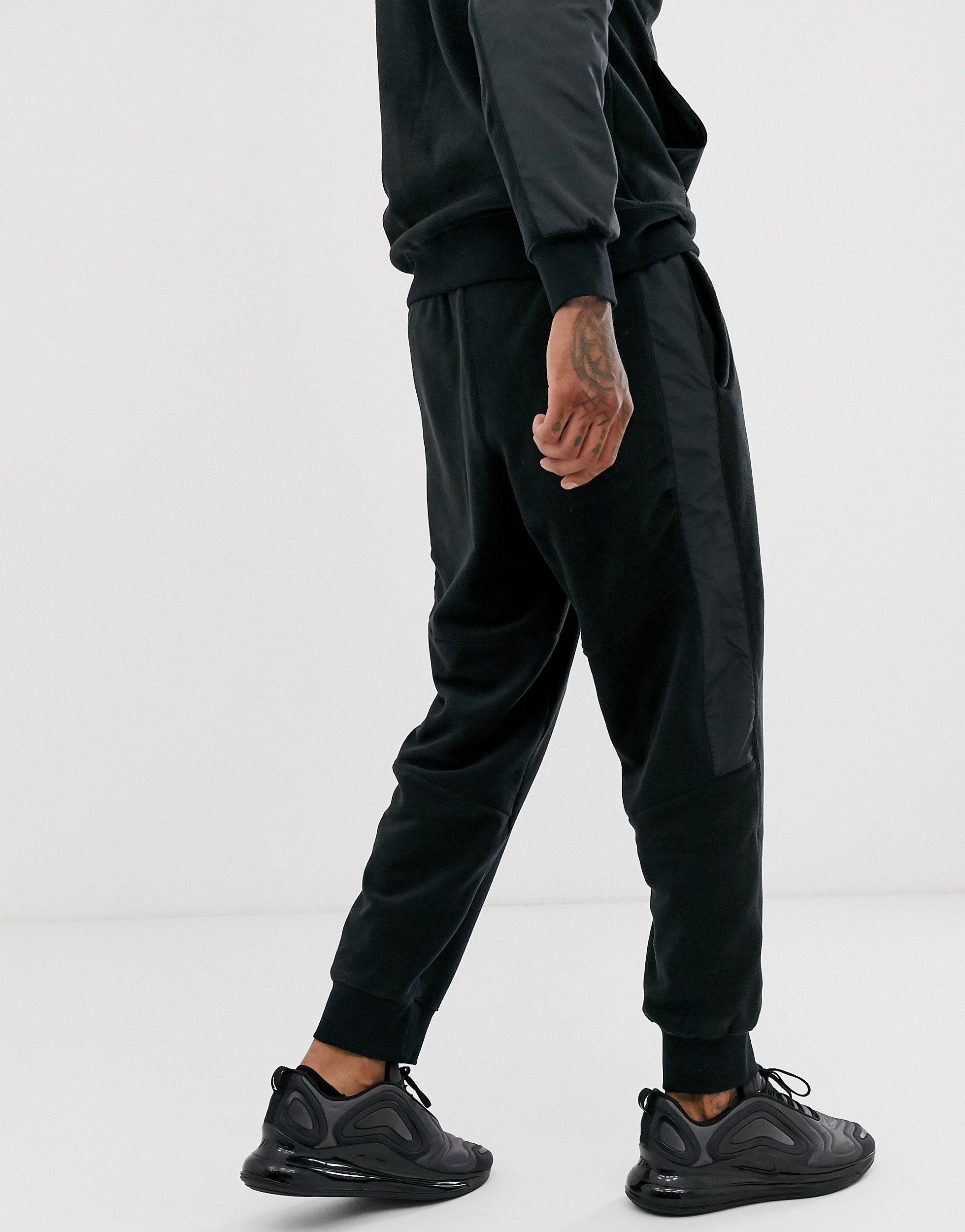 Nike Winter Fleece Cuffed Trackies With Nylon Panels in Black for Men ...