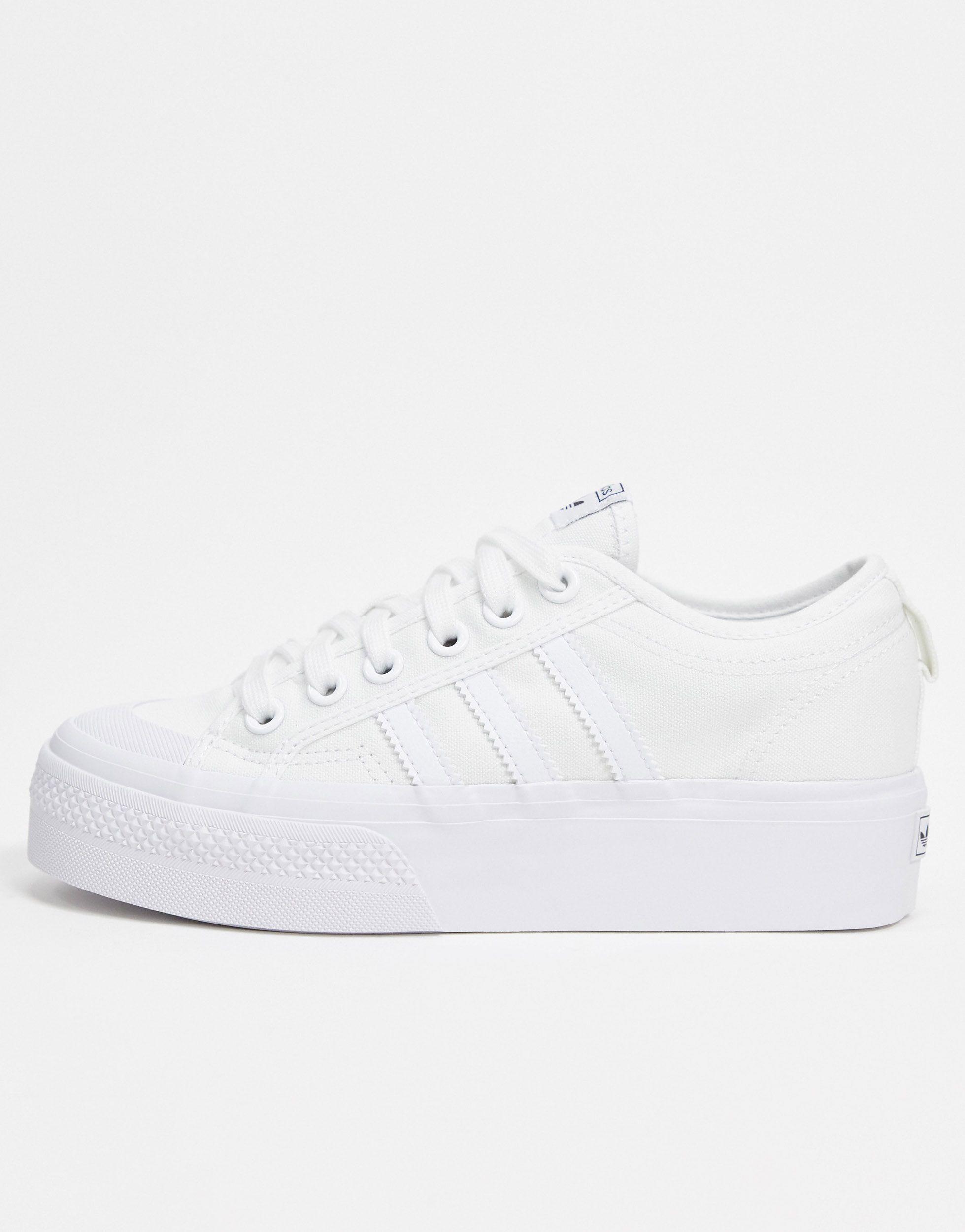 white nizza trainers