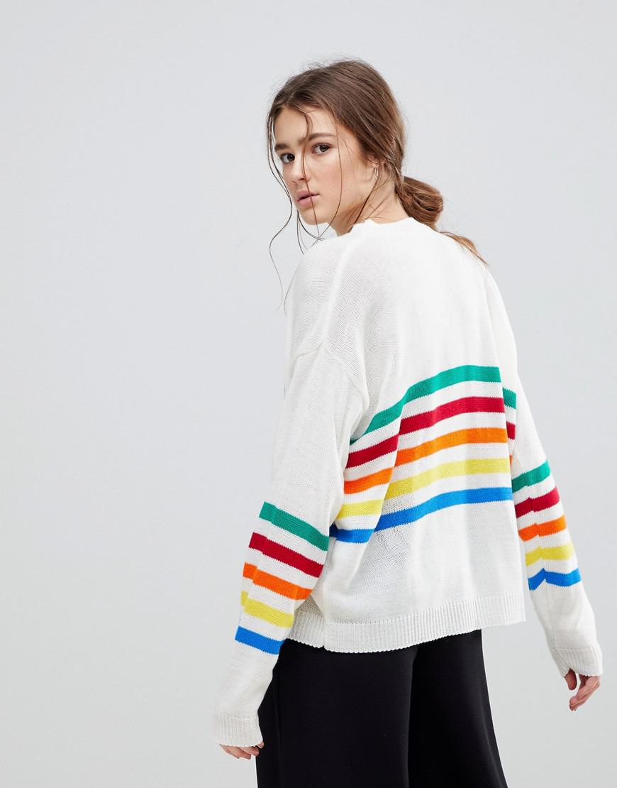 white sweater with rainbow stripe