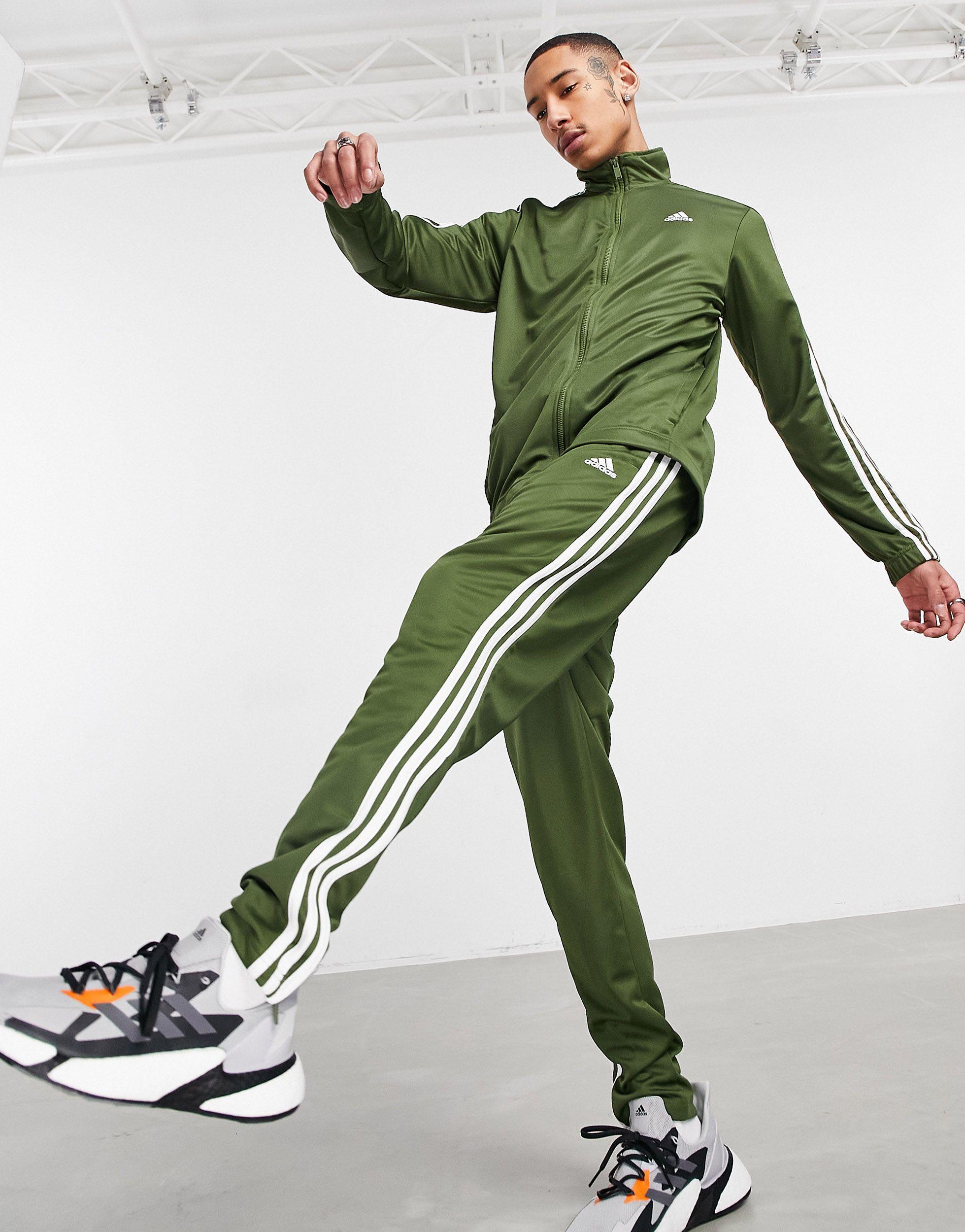 grey adidas tracksuit with green stripes