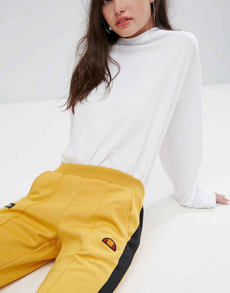 yellow tracksuit with black stripe