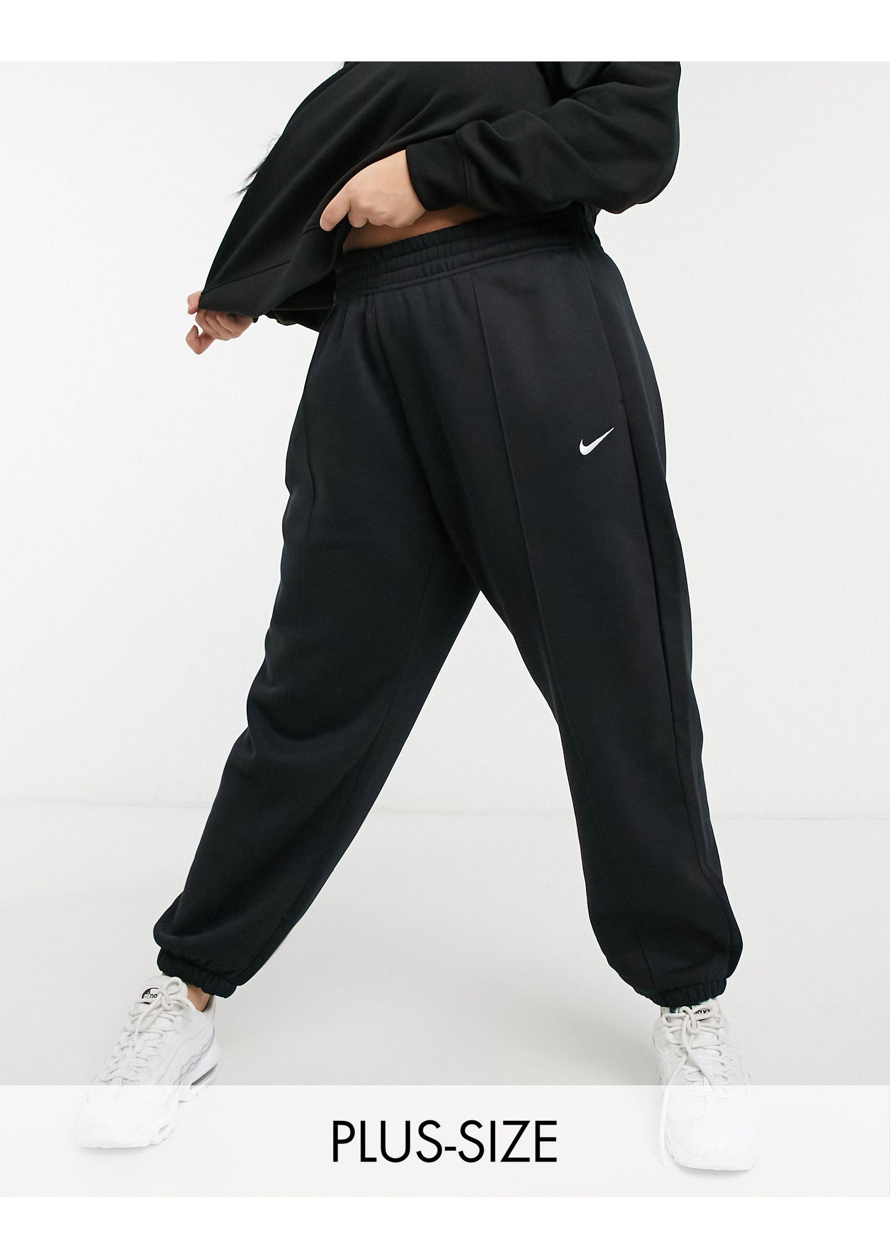 Nike Plus – oversize-jogginghose mit kleinem swoosh-logo in Schwarz - Lyst