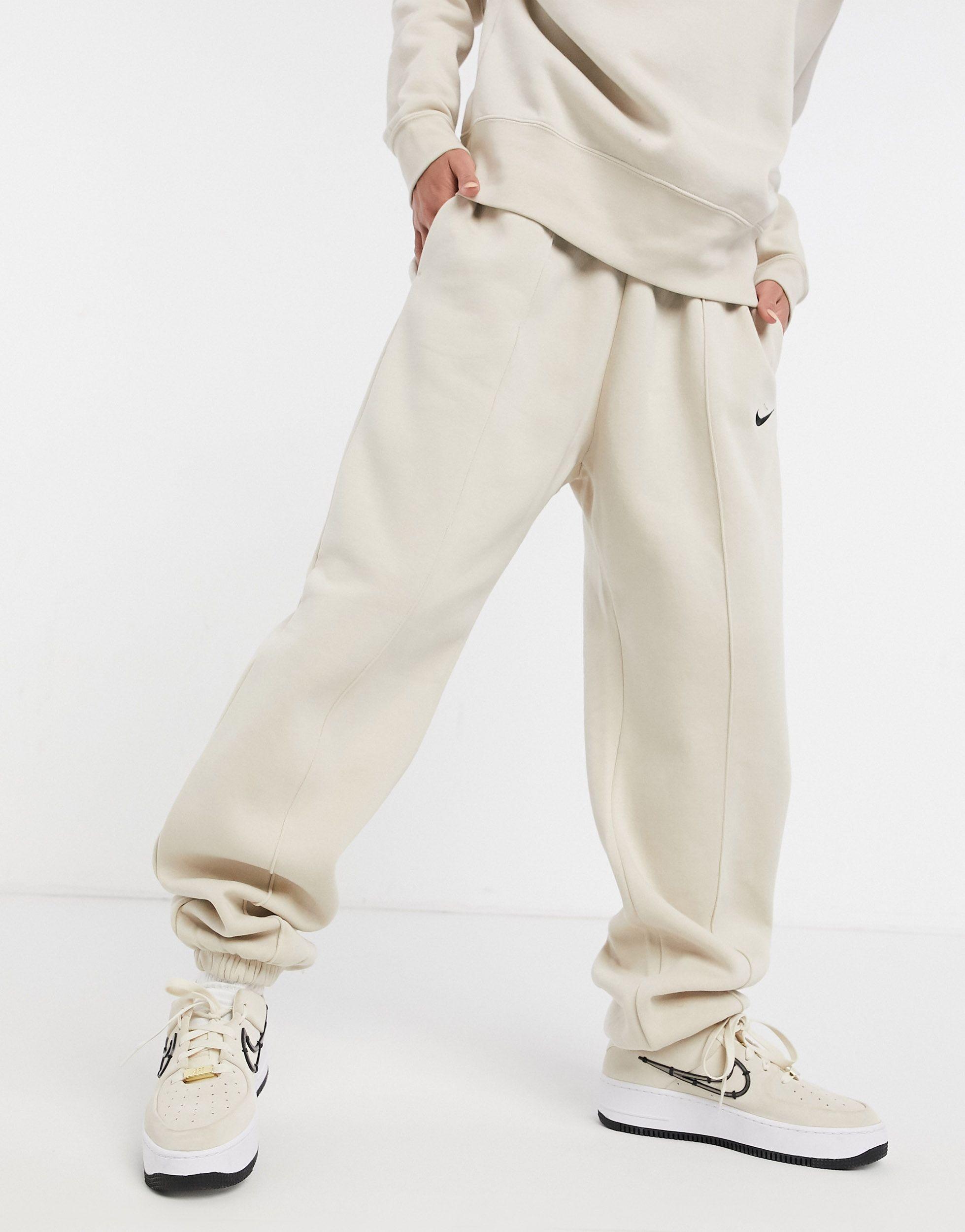 Nike Mini Swoosh Oversized joggers in Natural Lyst UK