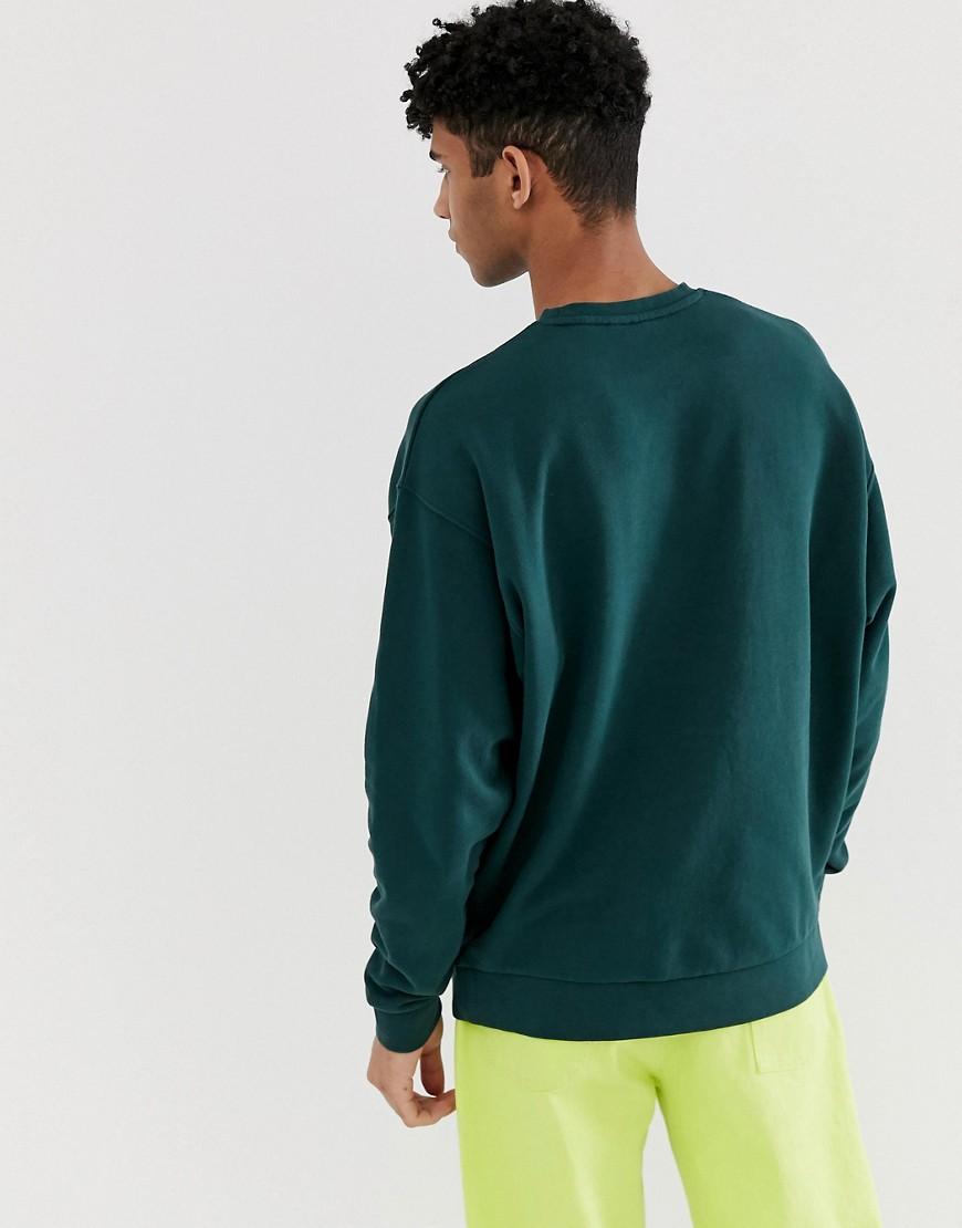green oversized sweatshirt