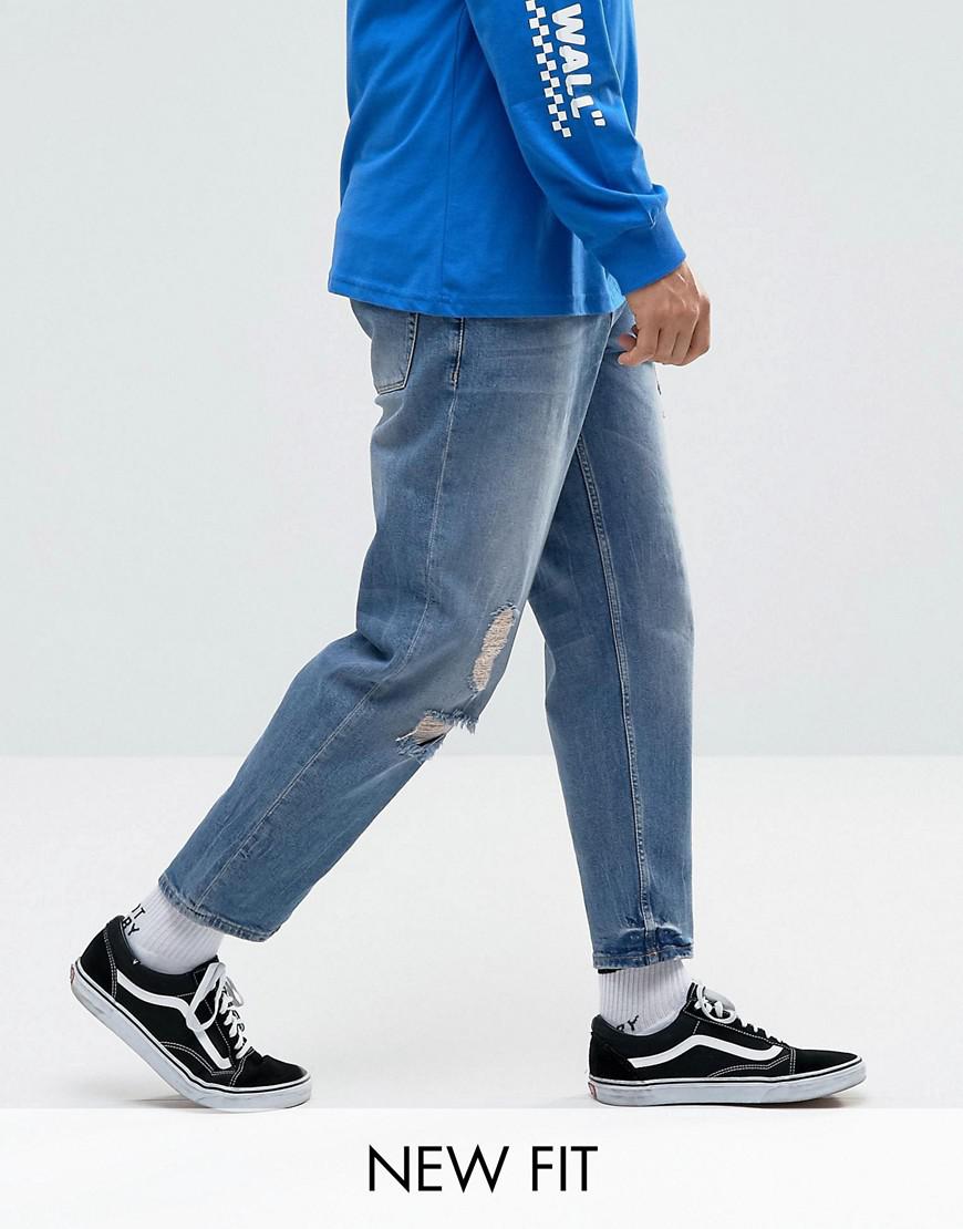 ASOS Asos Skater Jeans In Mid Wash Blue With Abrasions for Men | Lyst