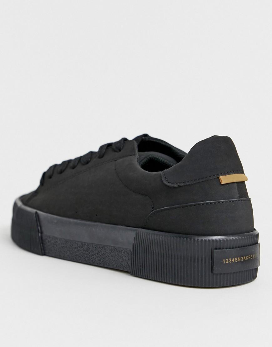 black chunky sole trainers