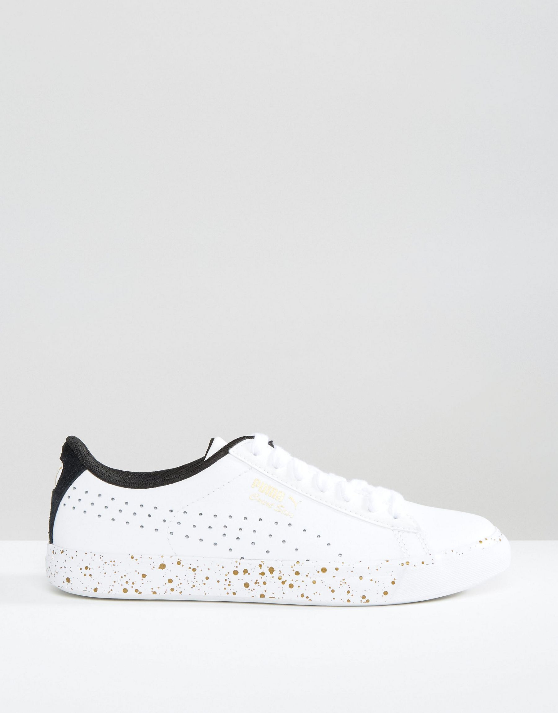 white leather puma shoes