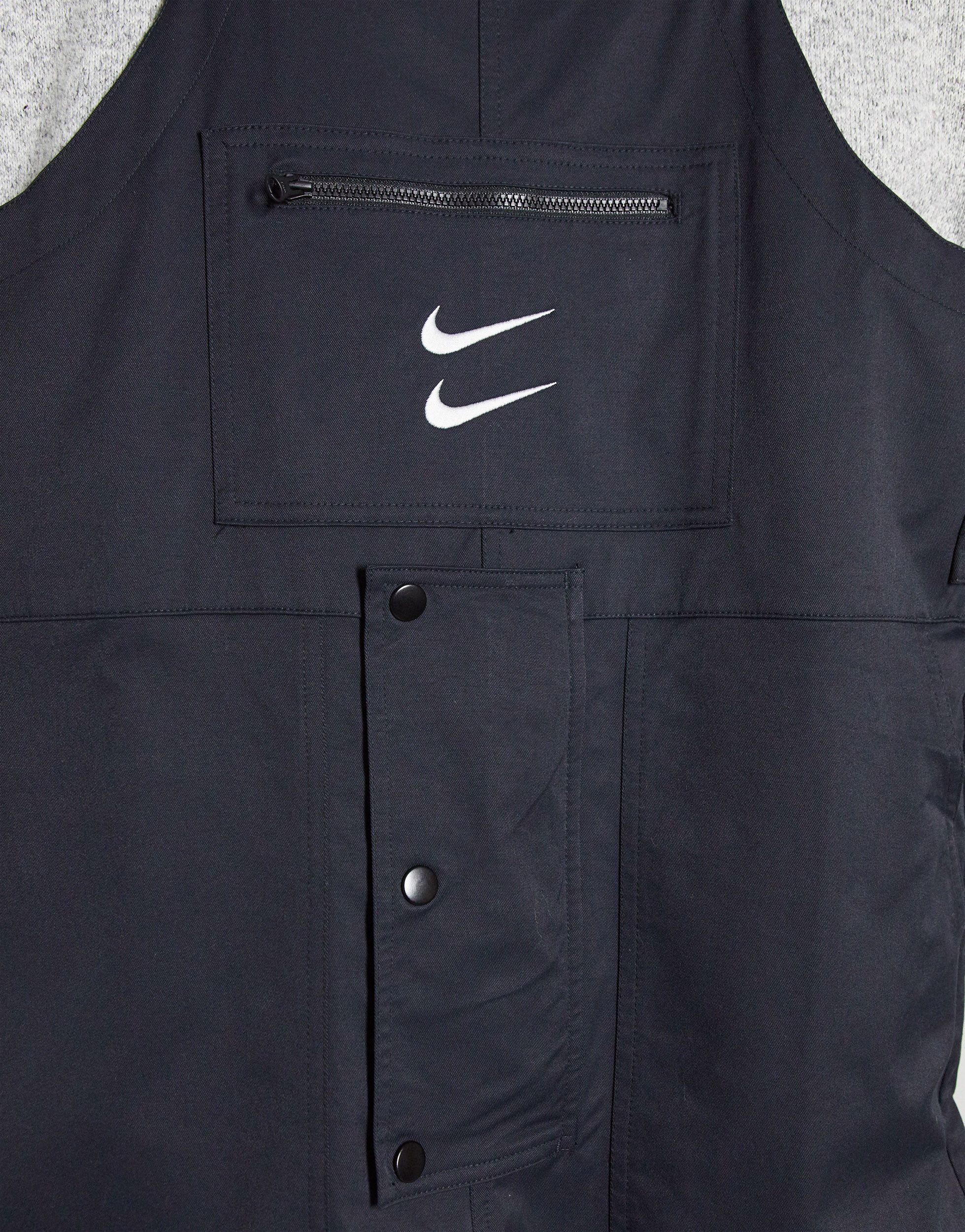nike swoosh woven dungarees in black