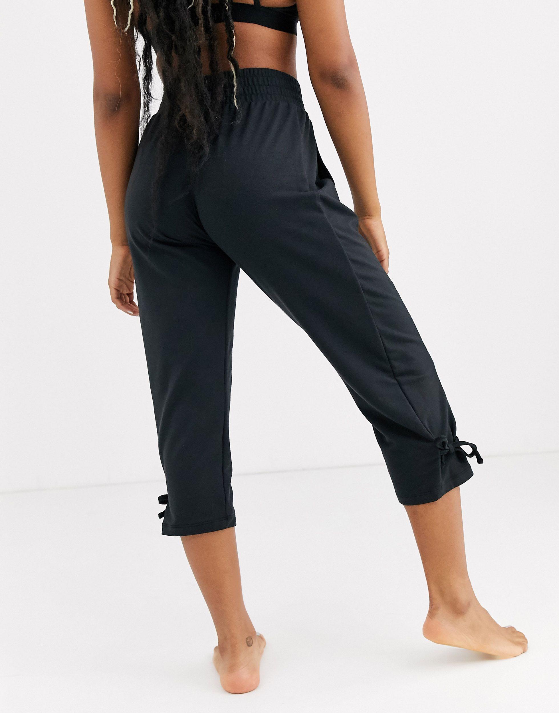 Nike Synthetic Nike Yoga Loose Fit Pants With Tie Detail in Black | Lyst