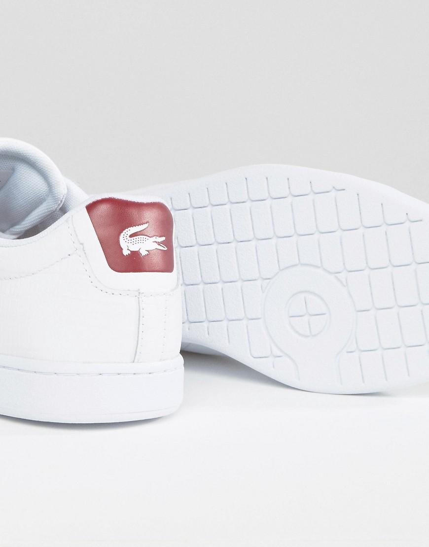 white trainers with red back