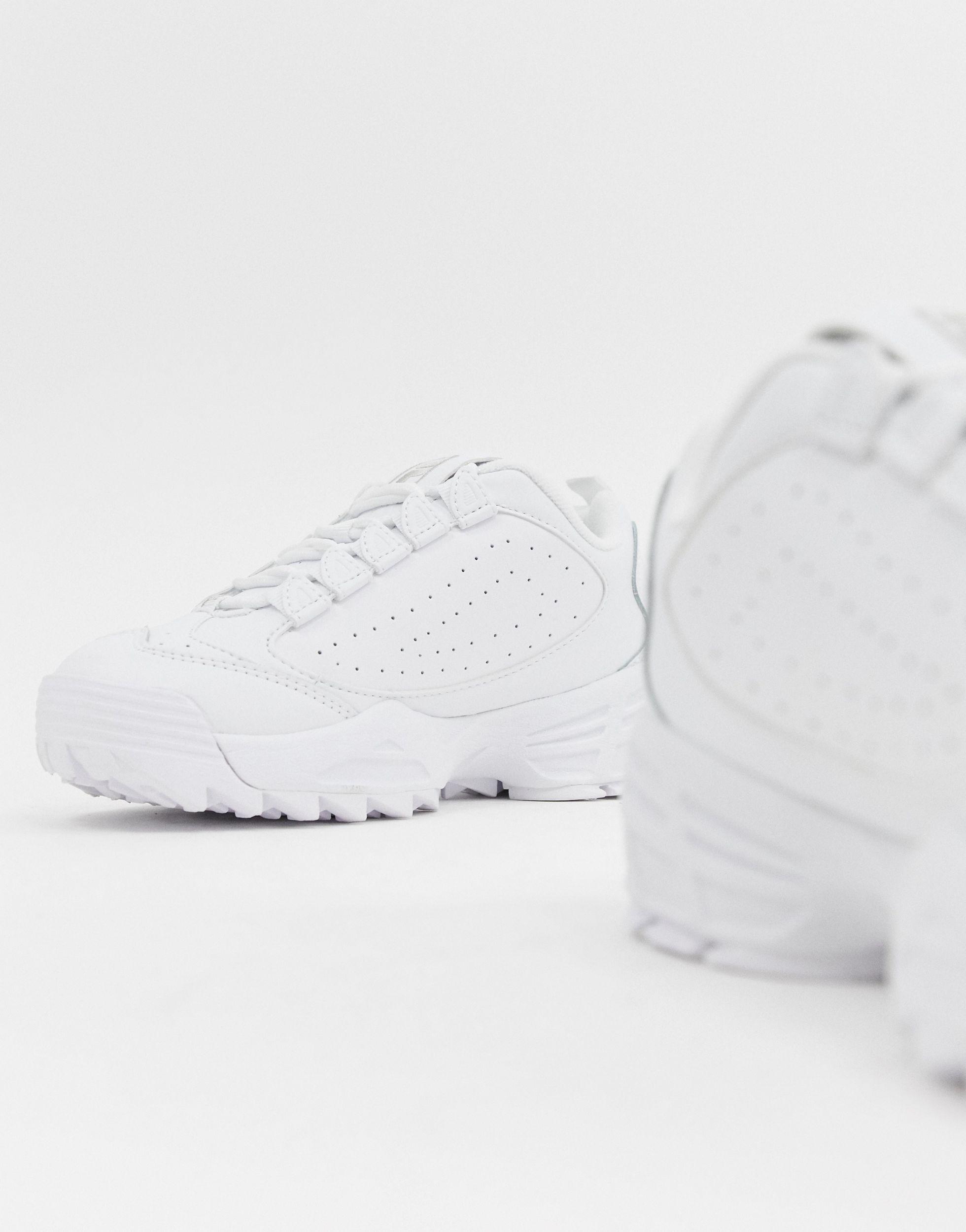 fila disruptor trainers in white