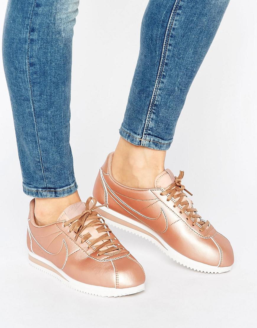 nike cortez trainers in black and rose gold