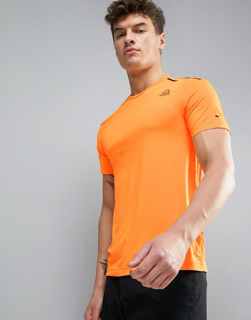 orange reebok shirt