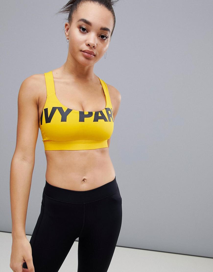 Ivy Park Logo Mesh Back Sports Bra in Yellow