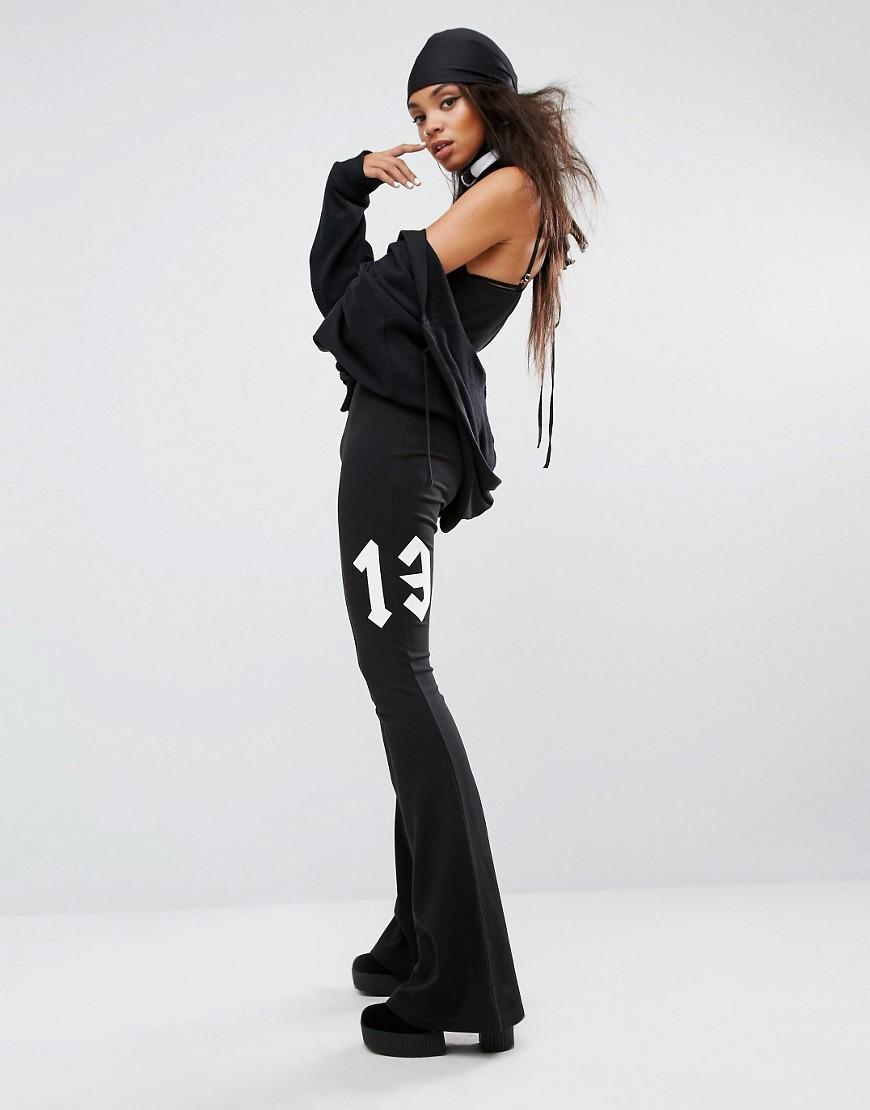 PUMA Fenty X By Rihanna Flared Jumpsuit in Black | Lyst