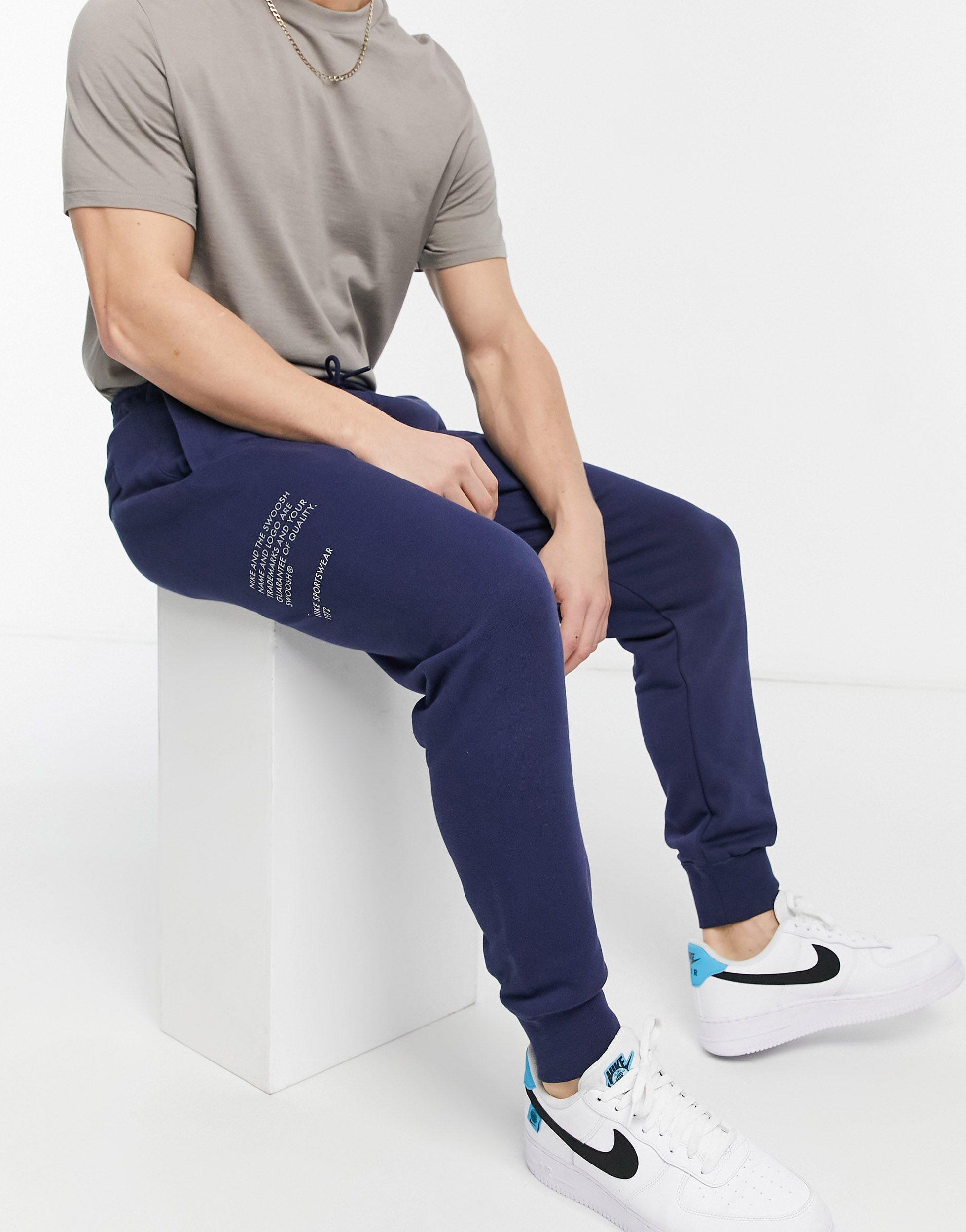 blue nike swoosh joggers