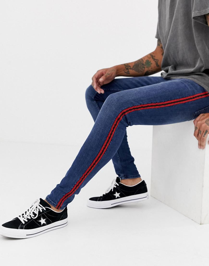 blue jeans with red stripe