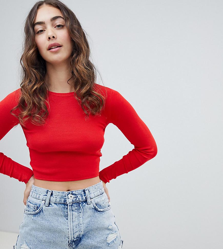 red cropped long sleeve shirt