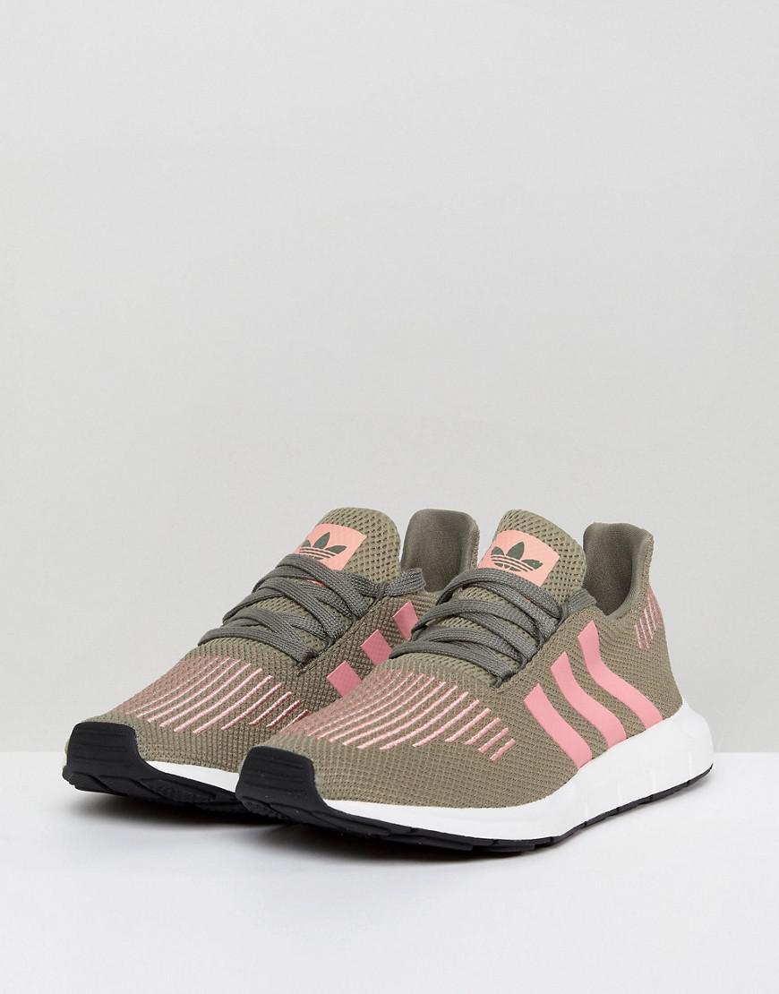 grey adidas trainers with pink stripes