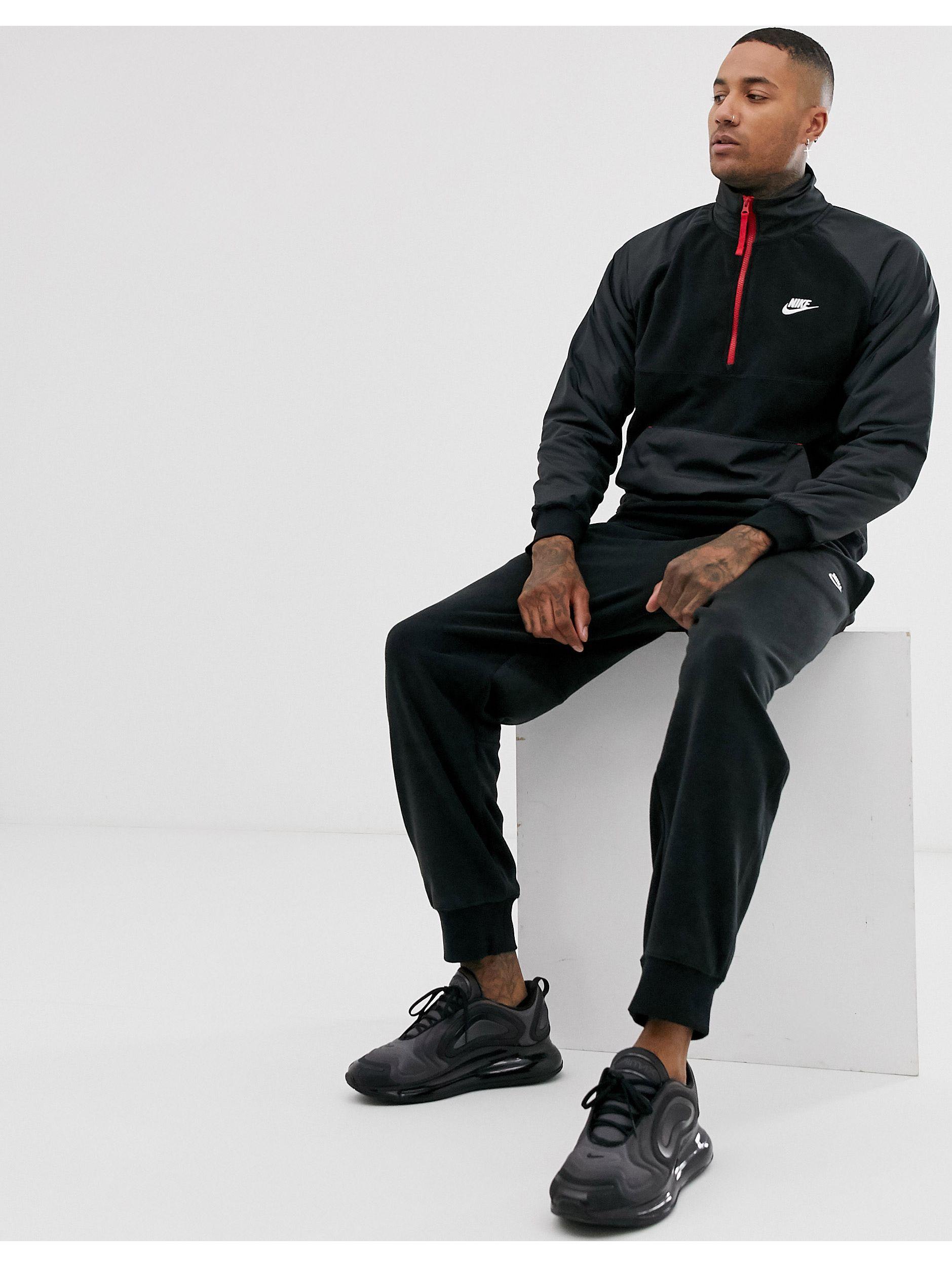 nike mini swoosh oversized trackies in black