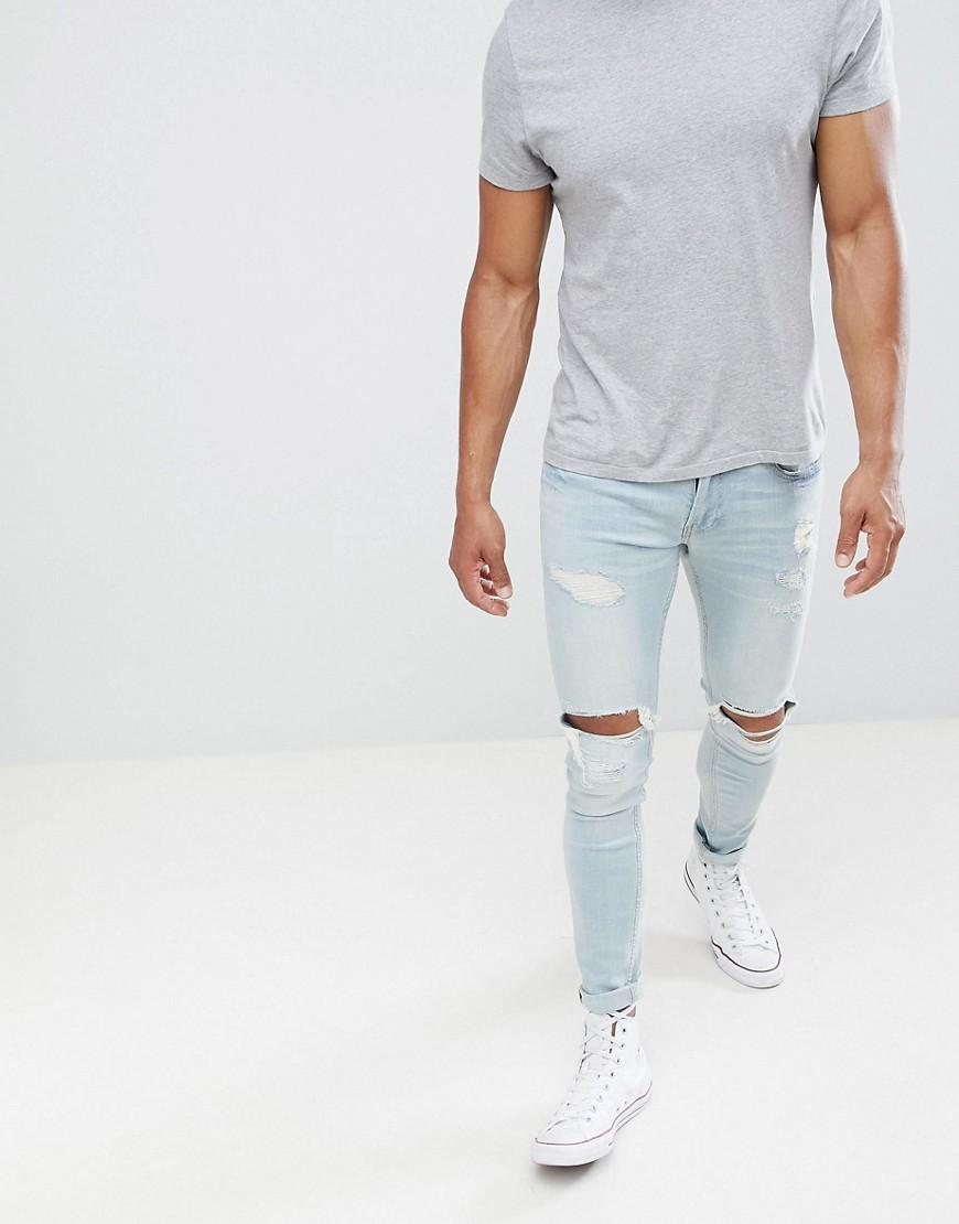 mens ripped jeans hollister