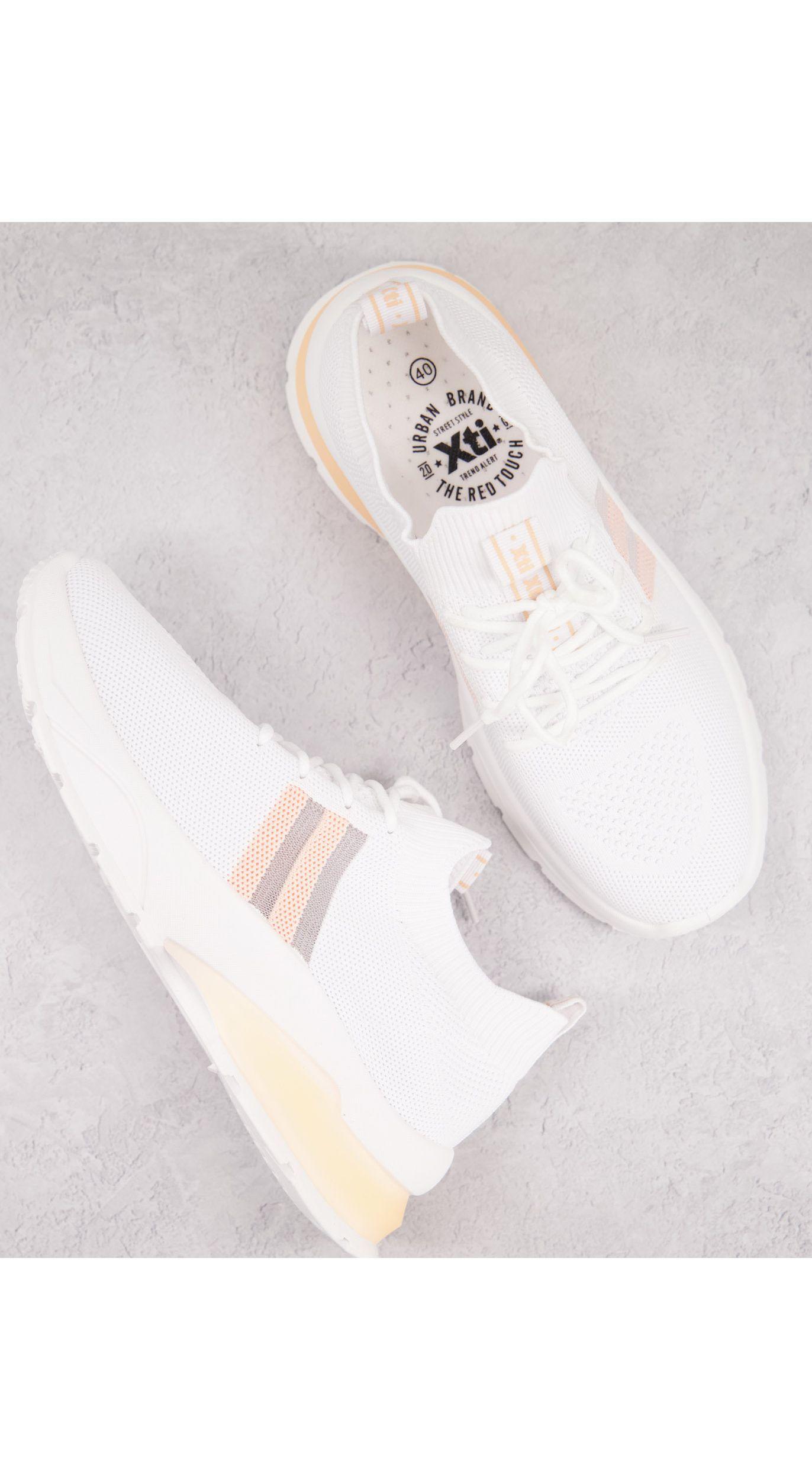 xti white trainers