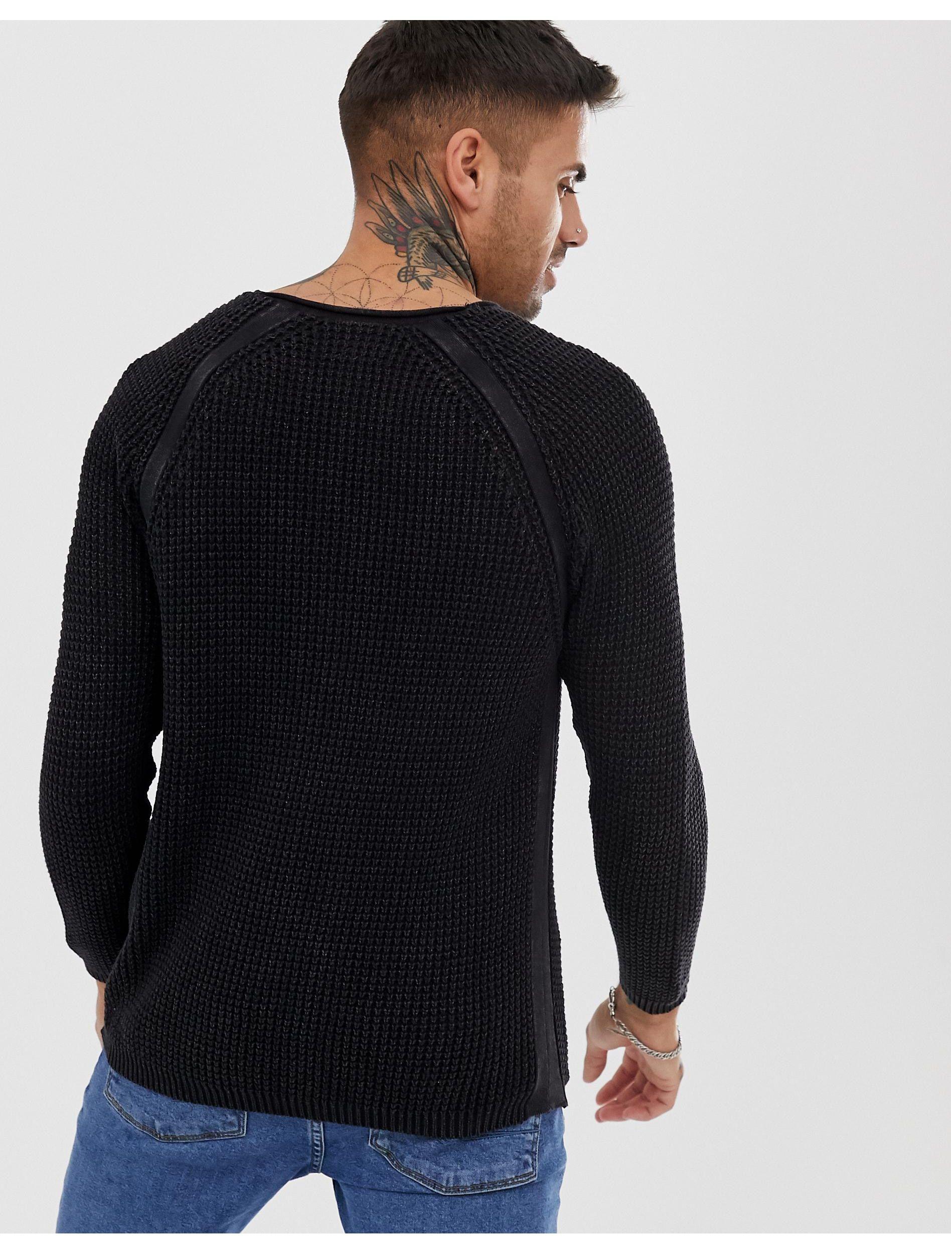 black jumper and jeans
