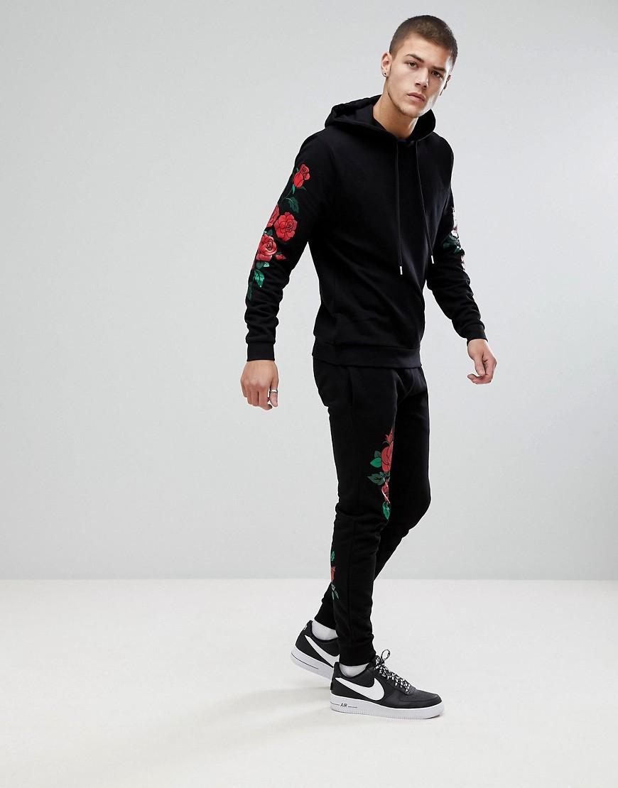 Tuta skinny nera con stampa di roseASOS in Denim da Uomo colore Nero | Lyst
