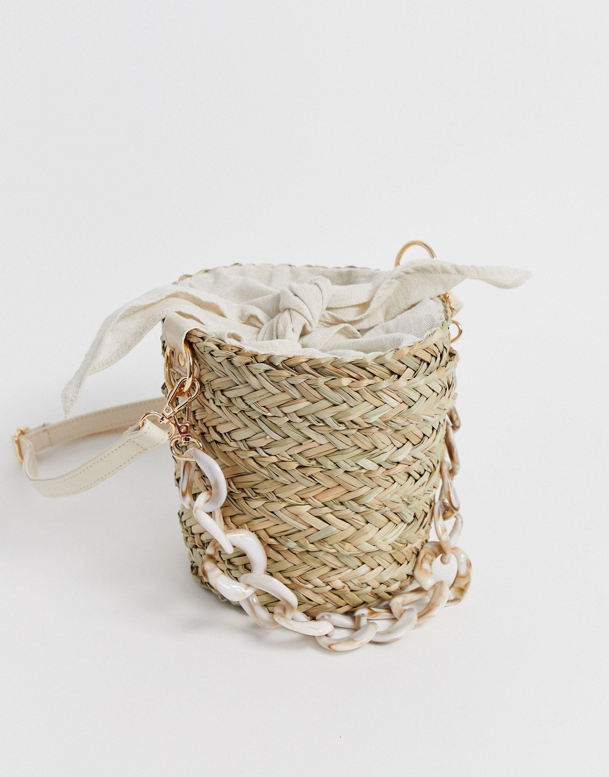 South Beach Straw Bucket Bag With Resin Link Handle And Linen Tie in  Natural | Lyst