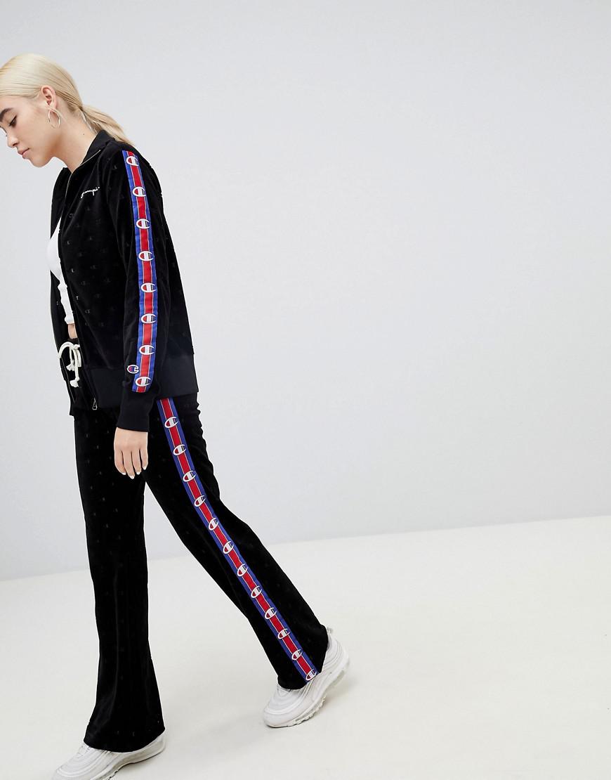 Champion Tracksuit Bottoms With All Over Logo And Side Tape In Velvet in  Black - Lyst