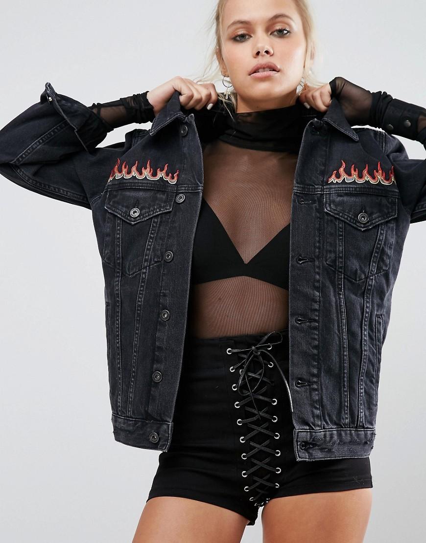 black jean jacket with flames