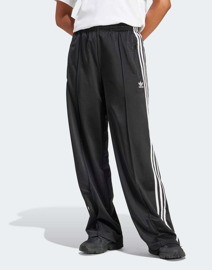 Pantalón Firebird Loose adidas de color Negro Lyst