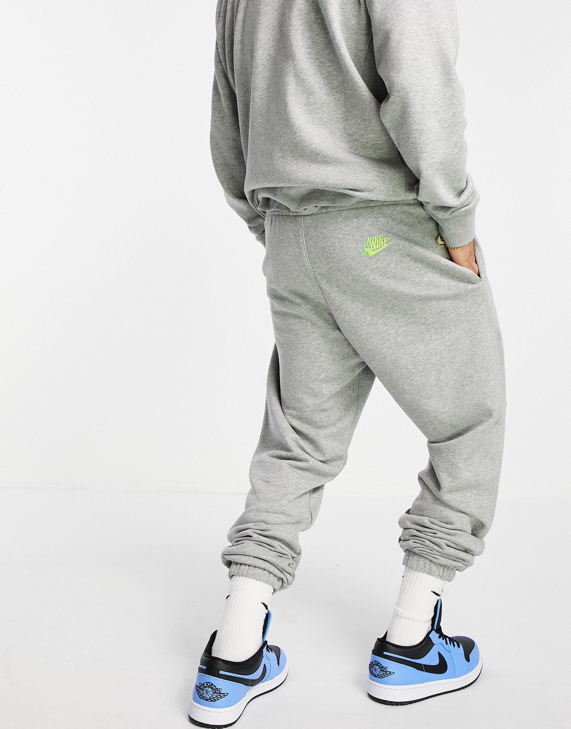 Nike Essential Fleece+ Multi Logo Casual Fit Cuffed Sweatpants in Grey for  Men | Lyst Canada