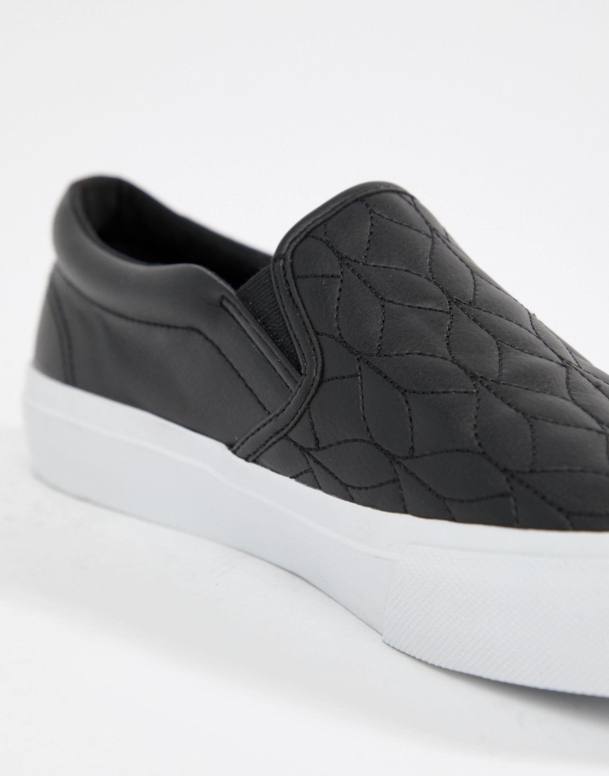 black slip on plimsolls