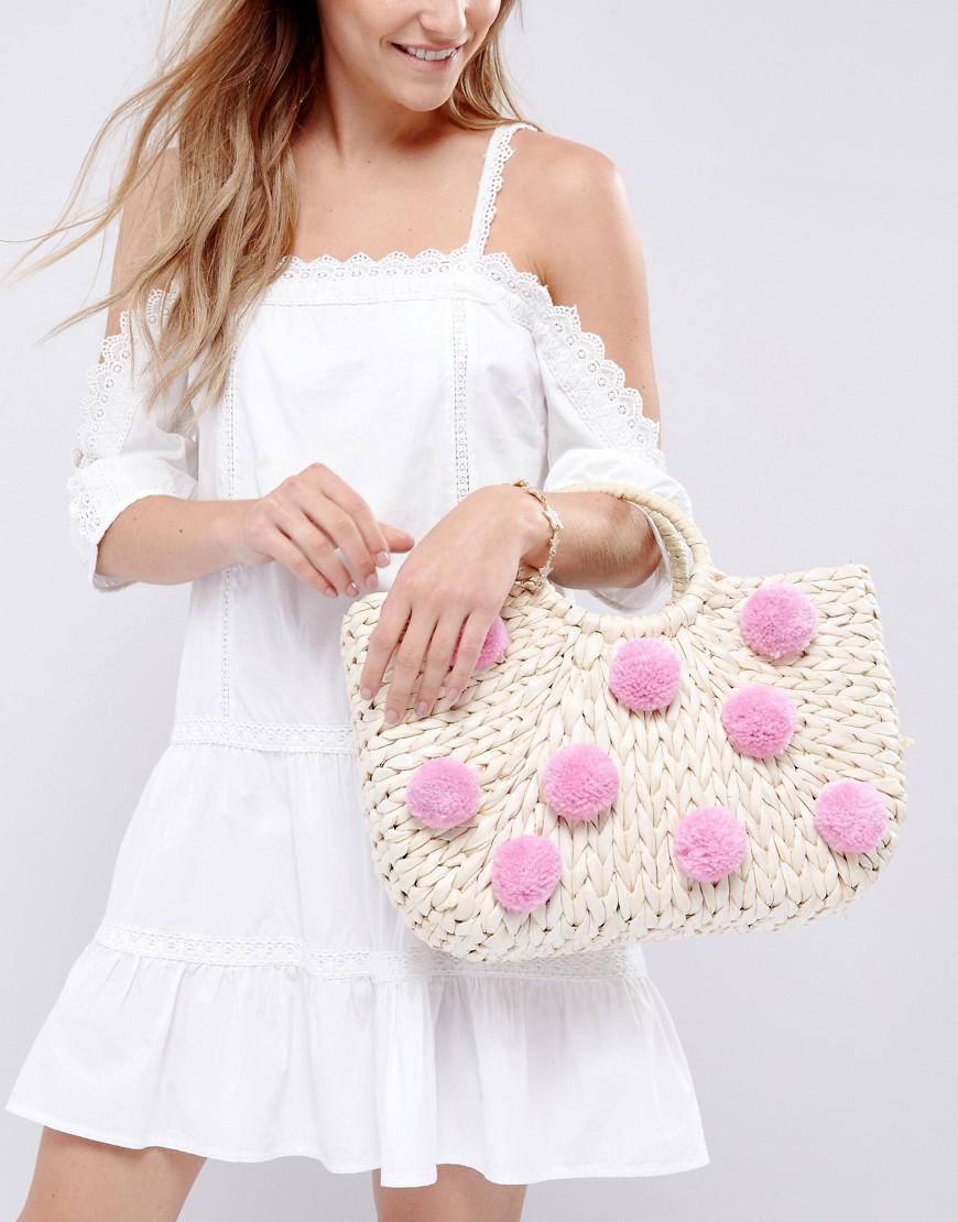 Skinnydip London Synthetic Straw Bag With All Over Pink Pom Poms in Beige (Natural) - Lyst