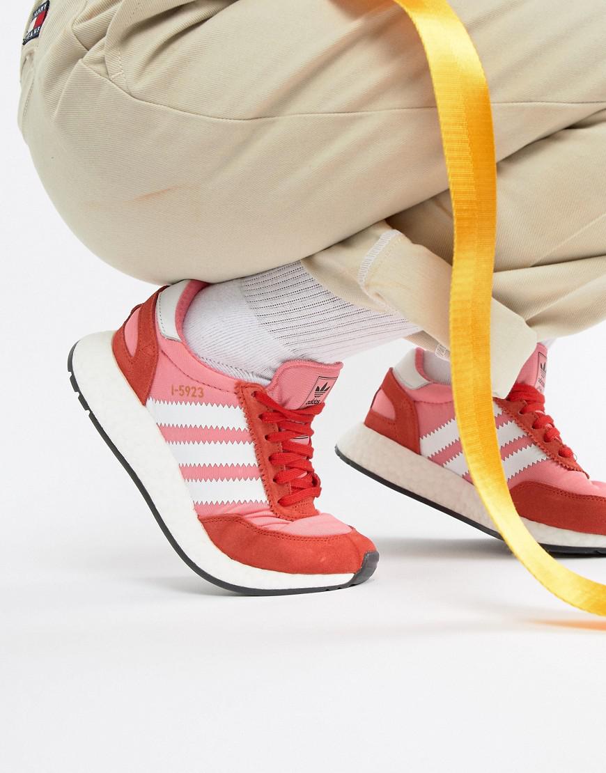 pink and red adidas trainers