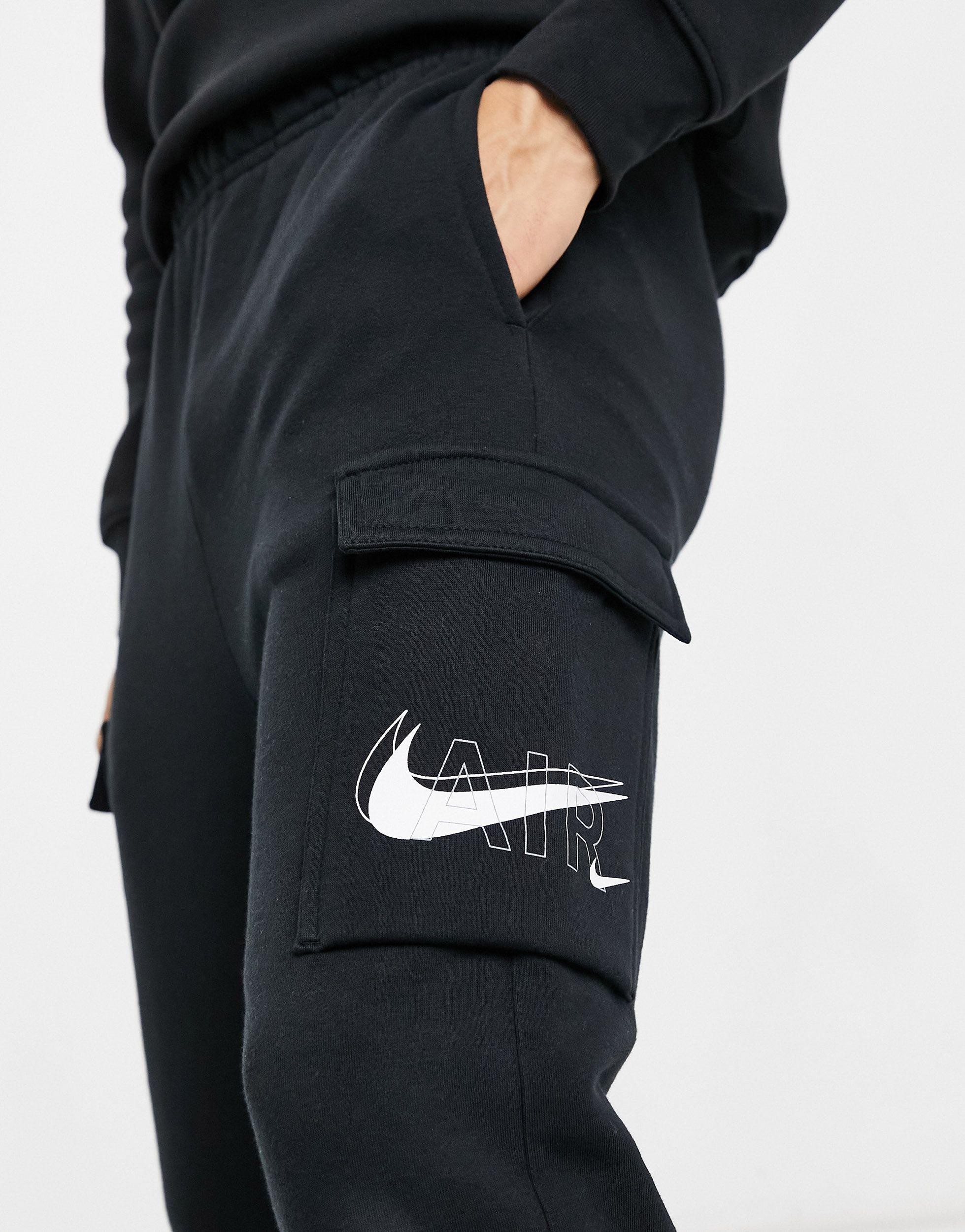nike swoosh on tour pack cuffed cargo joggers