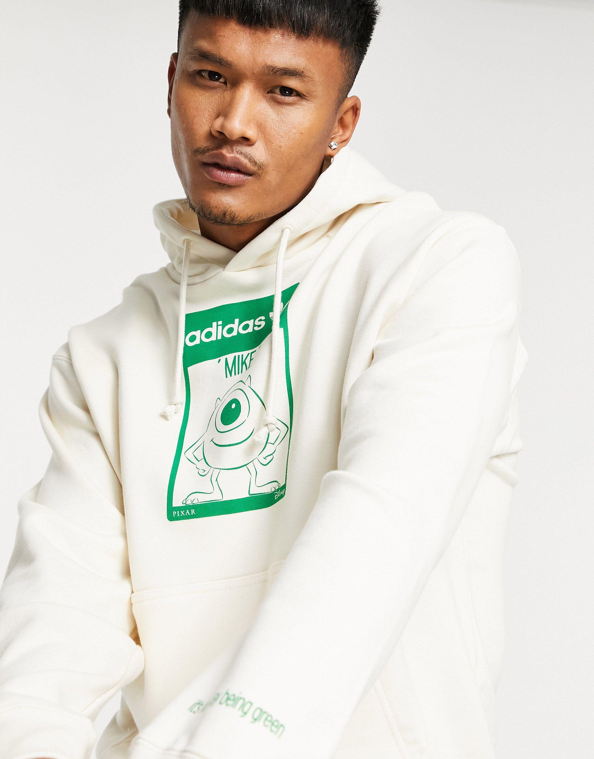 X disney - felpa con cappuccio unisex con stampa di mike wazowski sporco di  adidas Originals in Bianco | Lyst