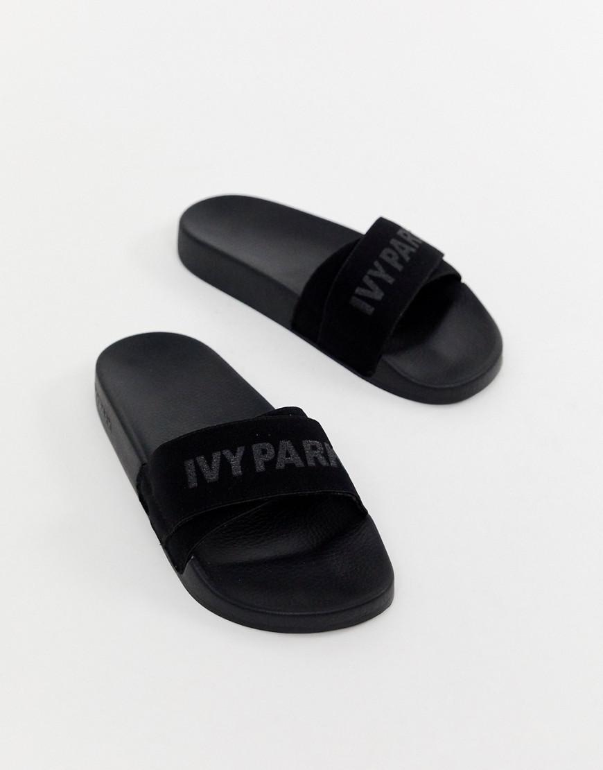 ivy park flip flops black