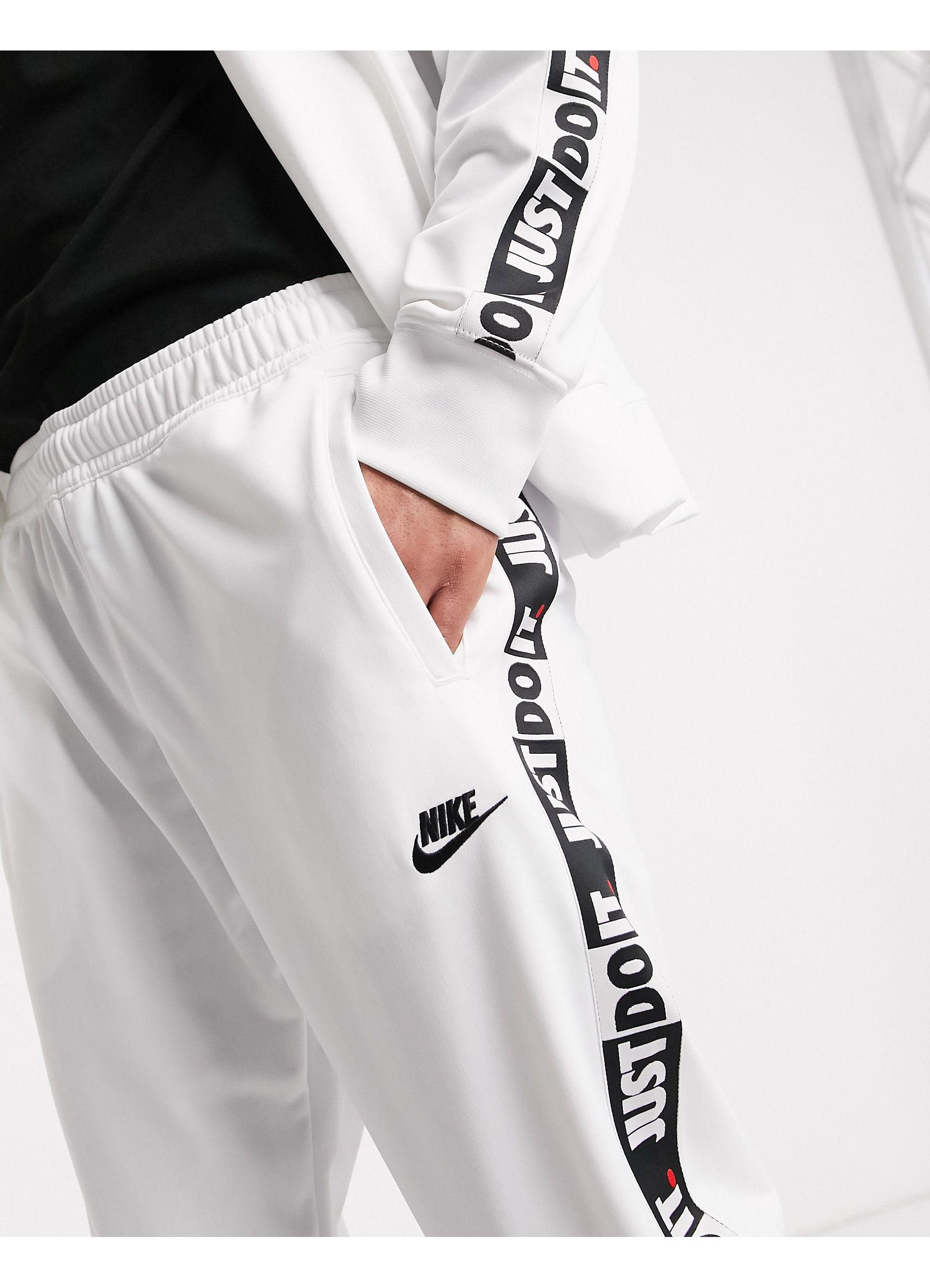 Nike Just Do It Taping Cuffed Sweatpants for Men - Lyst
