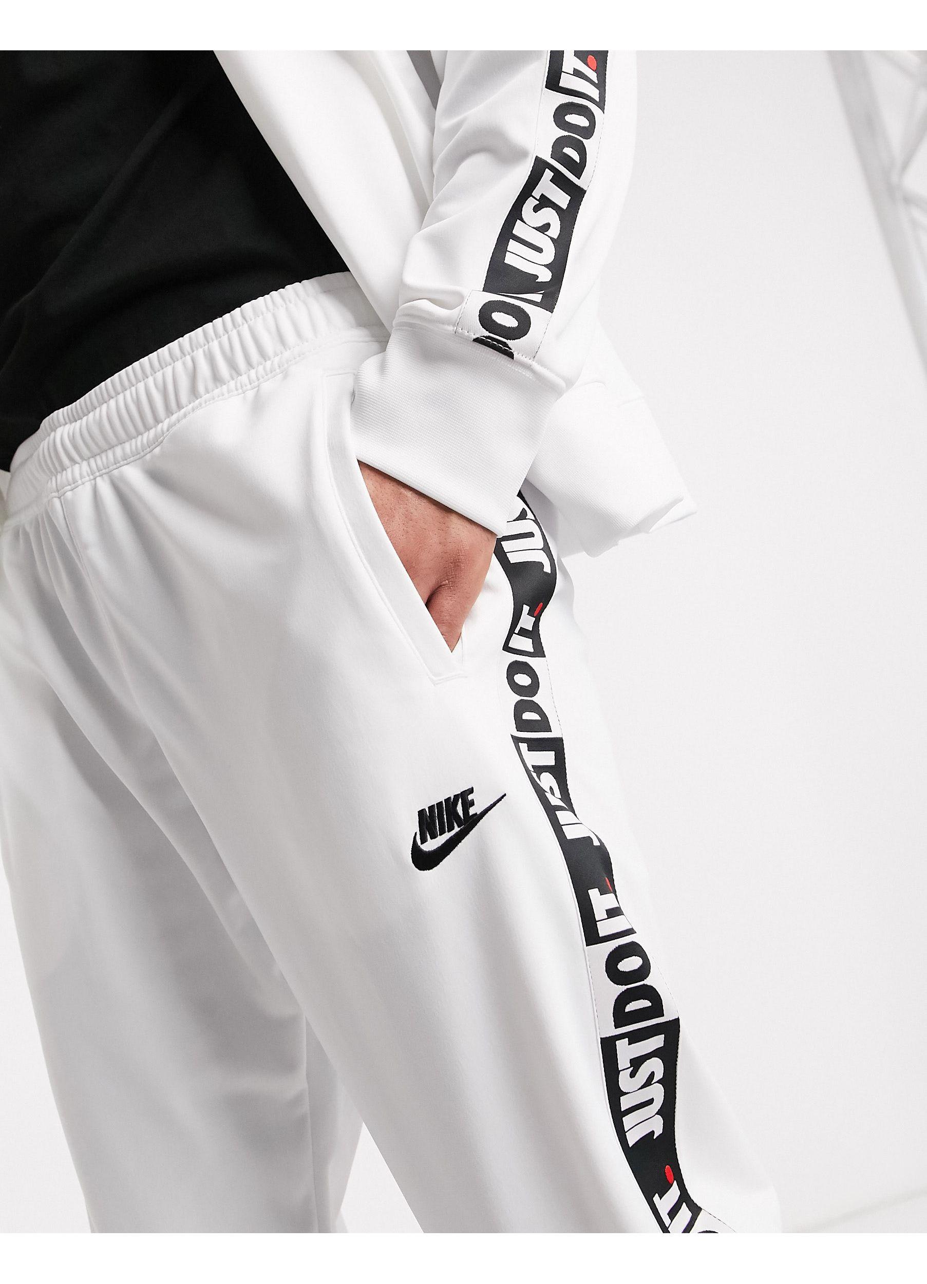 Nike Just Do It Taping Cuffed Sweatpants for Men | Lyst