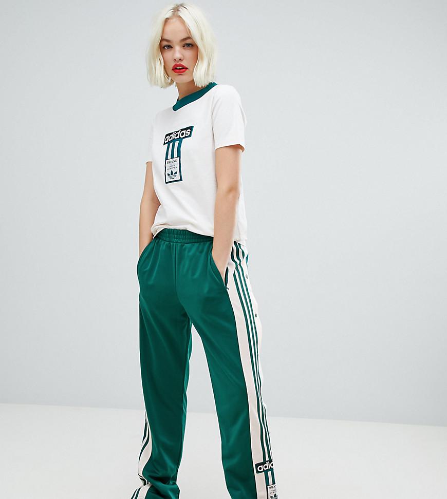 adidas Originals Three Stripe Popper Pant With Vintage Logo In Green | Lyst