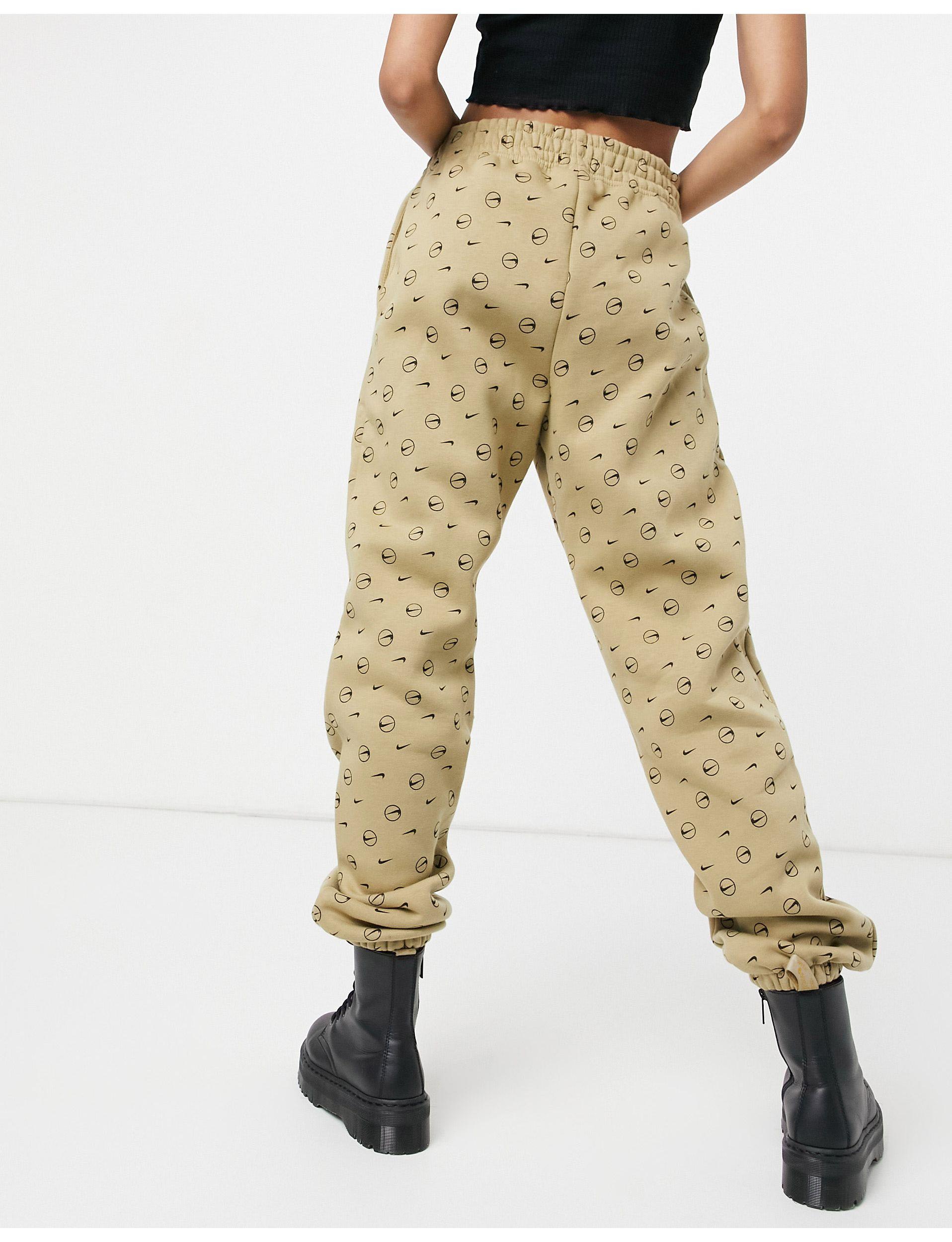 Nike All Over Logo Print joggers Lyst Australia